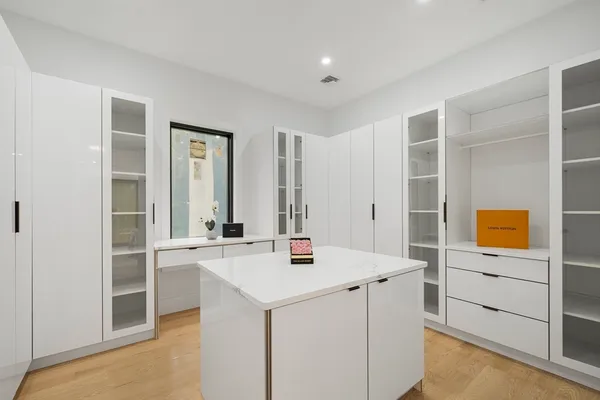 a view of kitchen with stainless steel appliances kitchen island sink refrigerator and stove