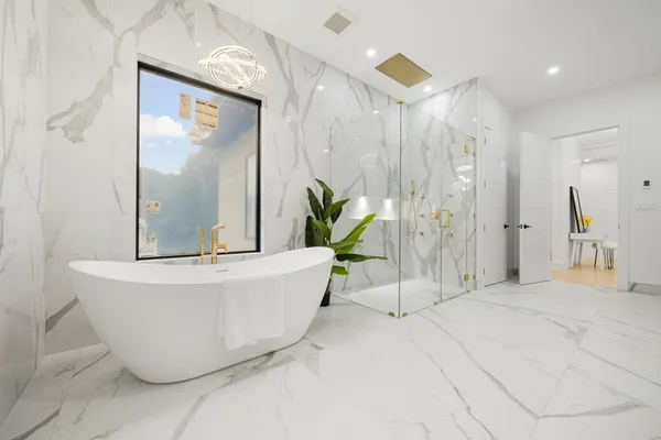a white bath tub sitting in a bathroom