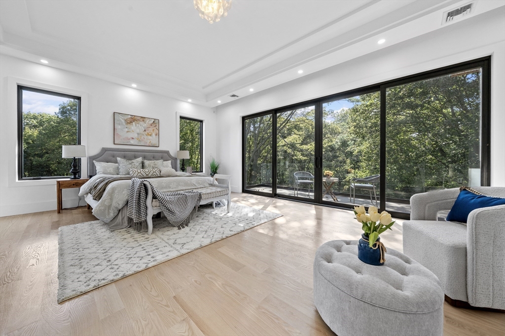 197 Woburn Street Lexington, MA 02420 - Photo 31 of 42 a bedroom with furniture and large windows