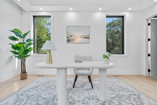 a workspace with furniture and a potted plant