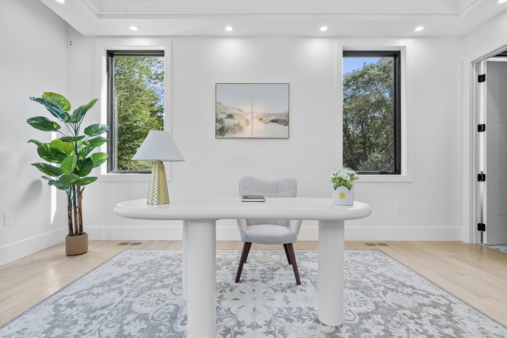 197 Woburn Street Lexington, MA 02420 - Photo 33 of 42 a workspace with furniture and a potted plant