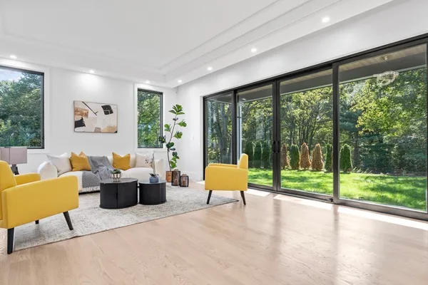 a living room with furniture and a large window