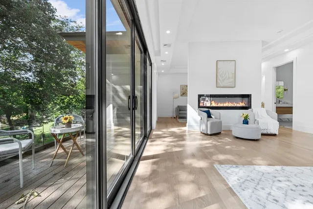 a view of a living room and a floor to ceiling window