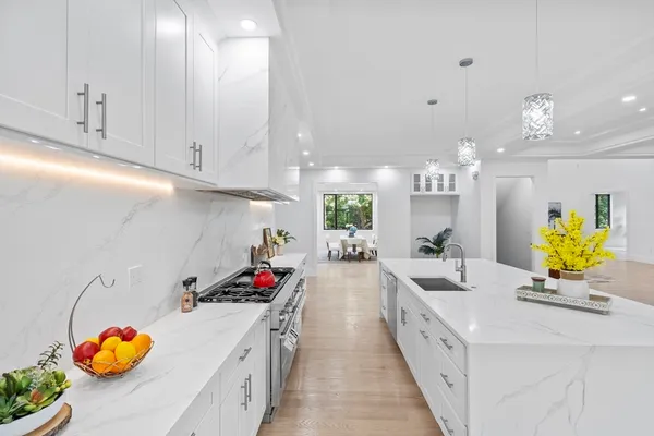 a kitchen with kitchen island granite countertop lots of counter top space