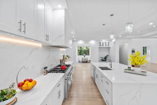 a kitchen with kitchen island granite countertop lots of counter top space