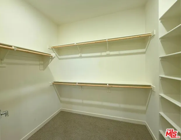 a view of small space with racks on the wall