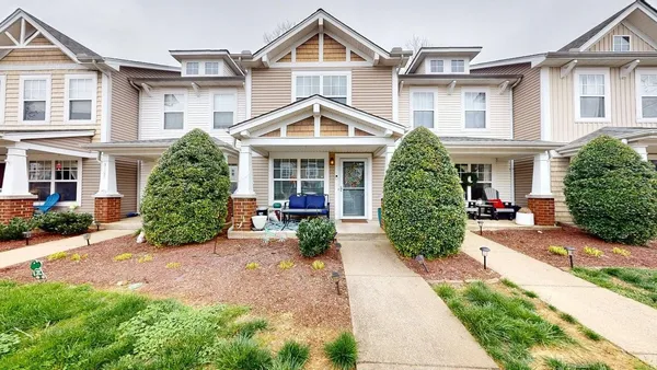 front view of a house with a yard