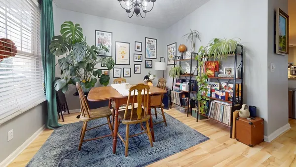 a dining room filled with lots of furniture