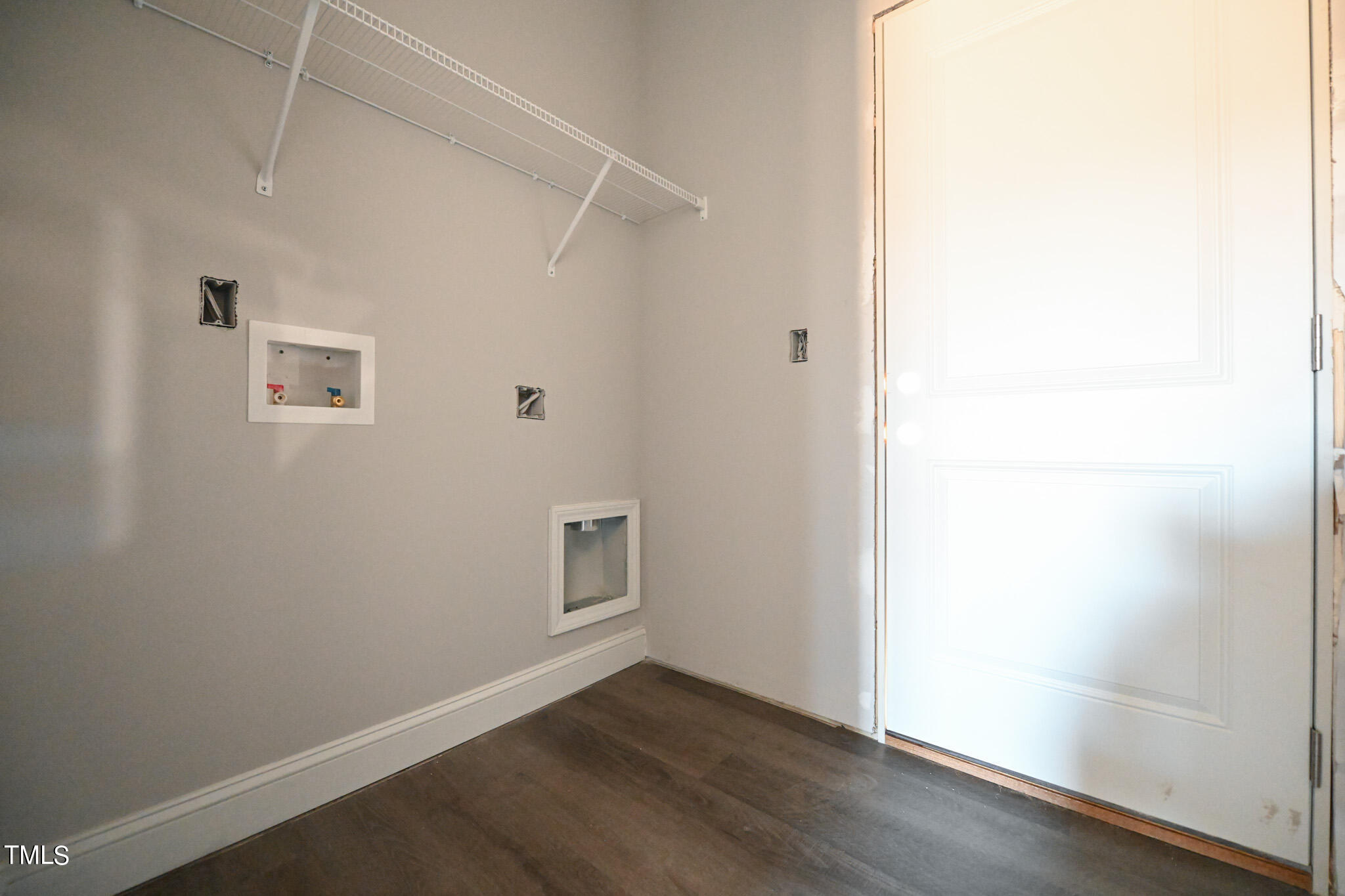150 Johnson Ridge Way Four Oaks, NC 27524 - Photo 13 of 24 a view of an empty room with wooden floor