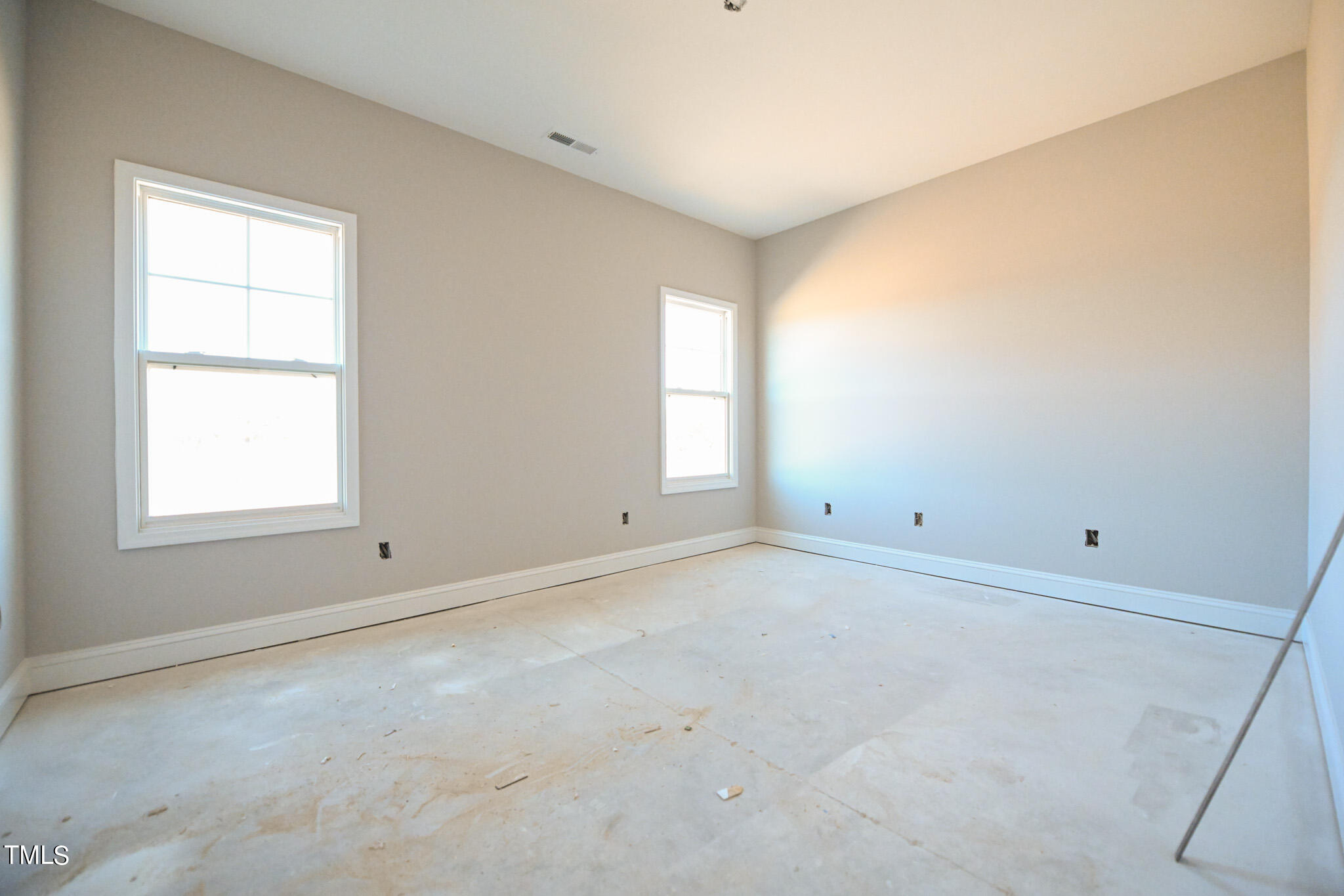 150 Johnson Ridge Way Four Oaks, NC 27524 - Photo 14 of 24 an empty room with a window