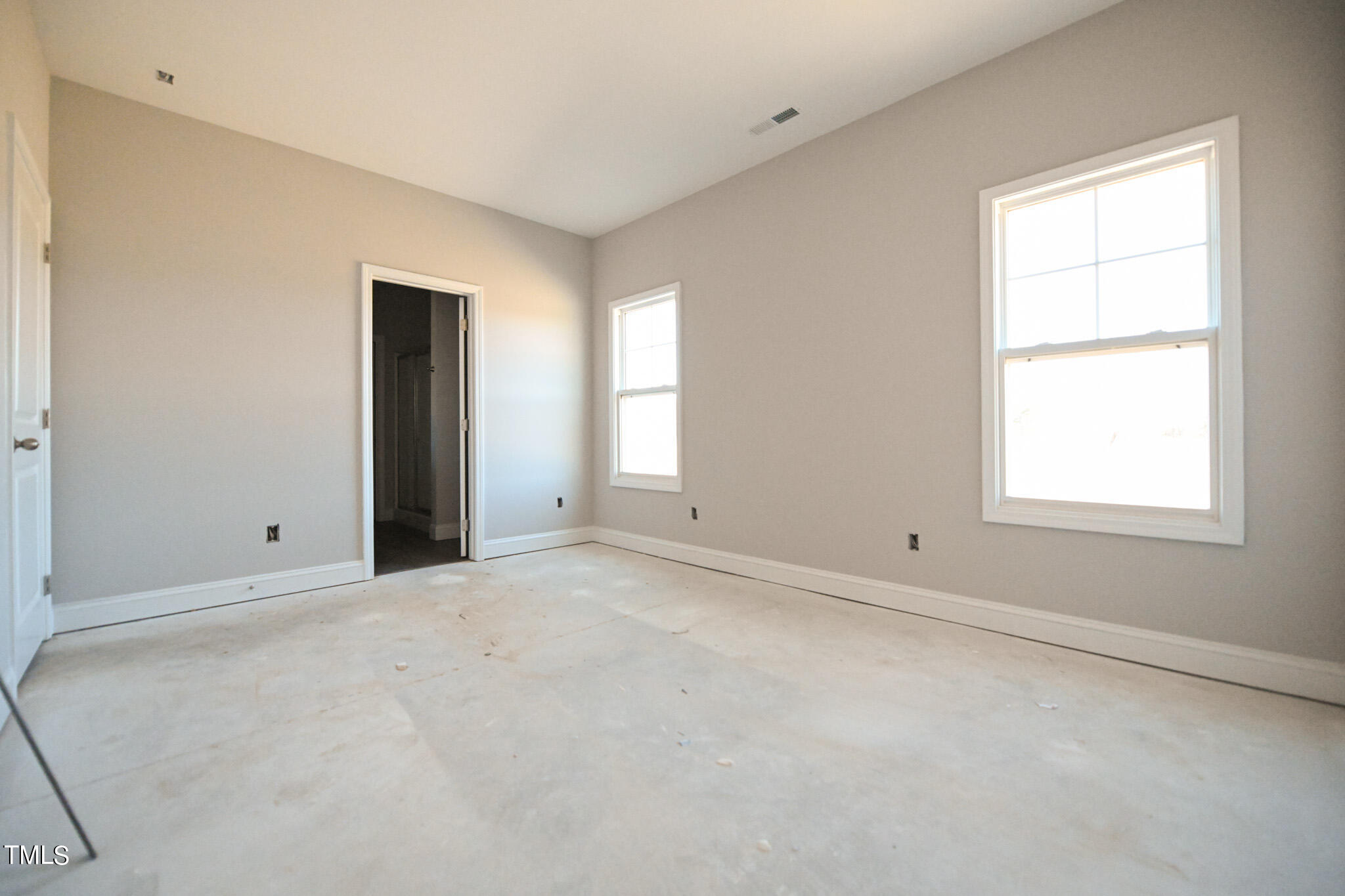 150 Johnson Ridge Way Four Oaks, NC 27524 - Photo 15 of 24 an empty room with a window