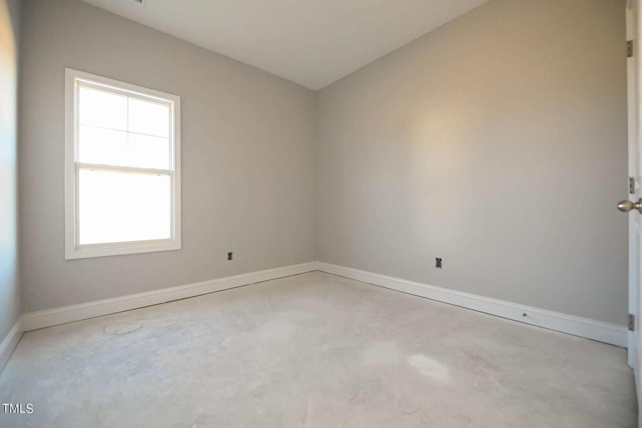150 Johnson Ridge Way Four Oaks, NC 27524 - Photo 17 of 24 an empty room with a window