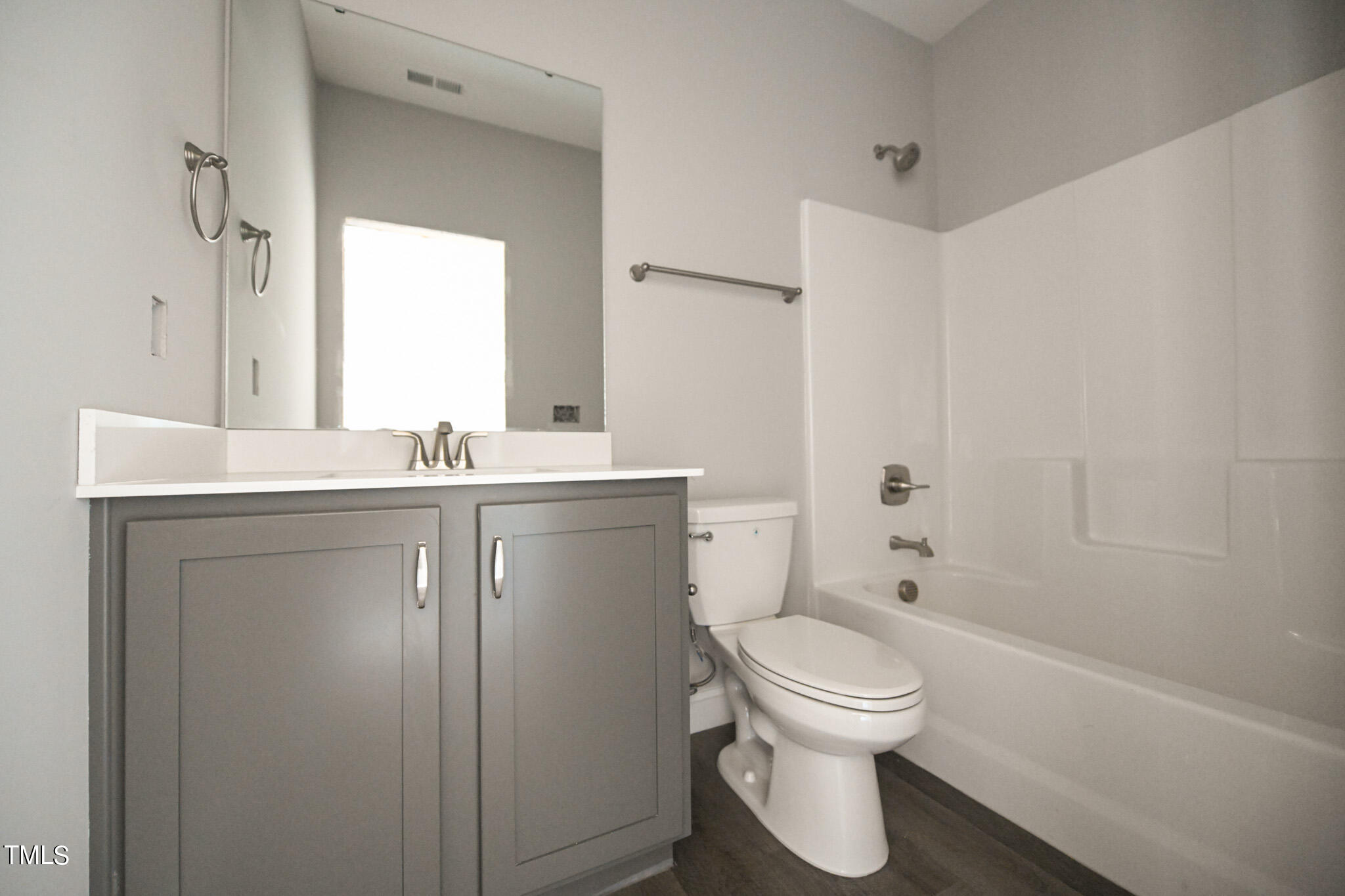 150 Johnson Ridge Way Four Oaks, NC 27524 - Photo 19 of 24 a bathroom with a toilet sink and mirror