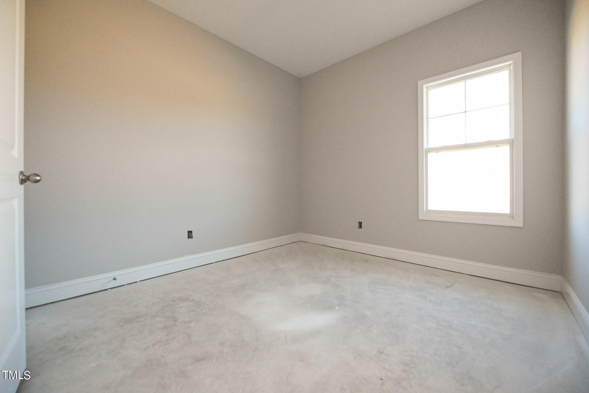 150 Johnson Ridge Way Four Oaks, NC 27524 - Photo 20 of 24 an empty room with a window