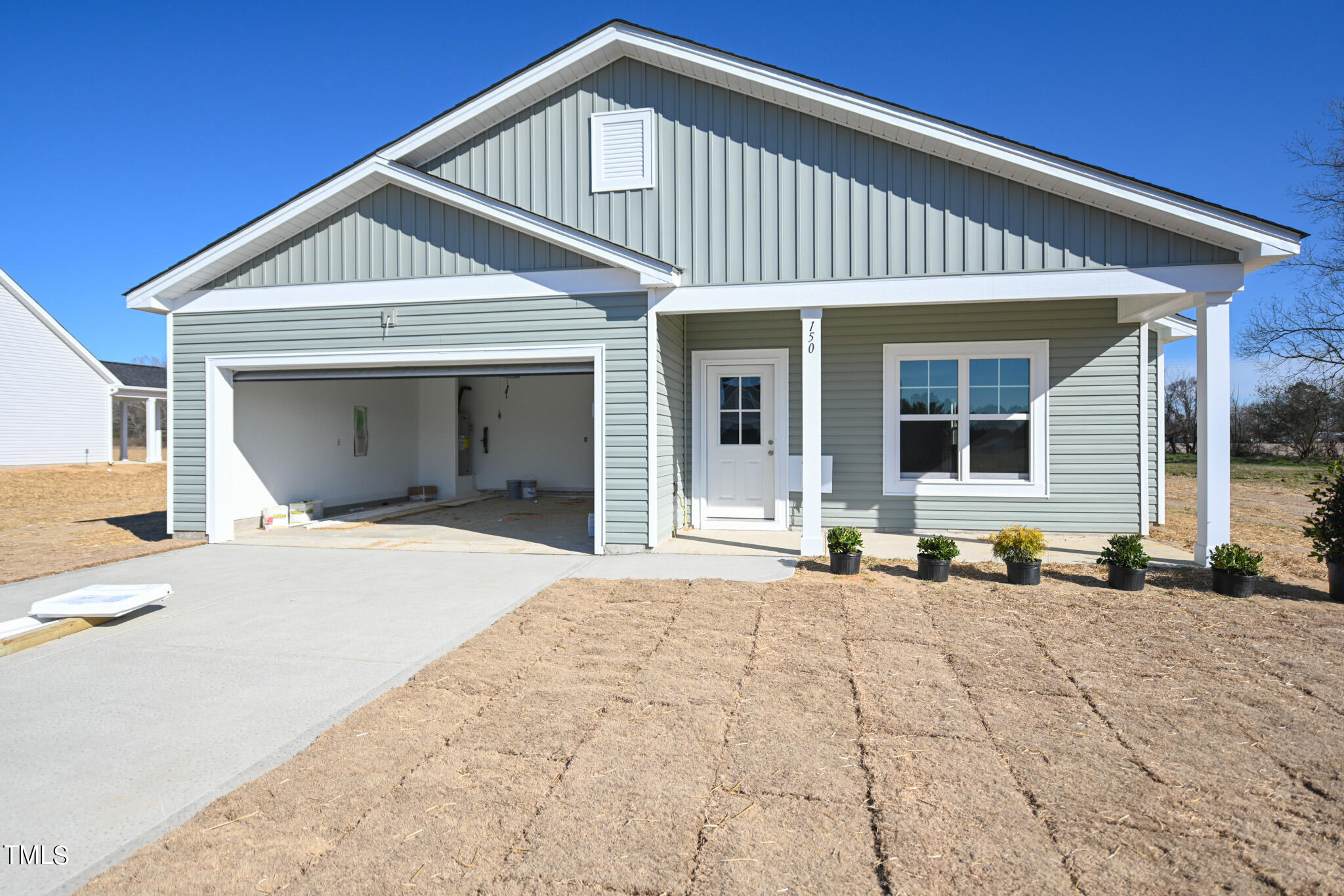 150 Johnson Ridge Way Four Oaks, NC 27524 - Photo 2 of 24 a front view of a house with a yard
