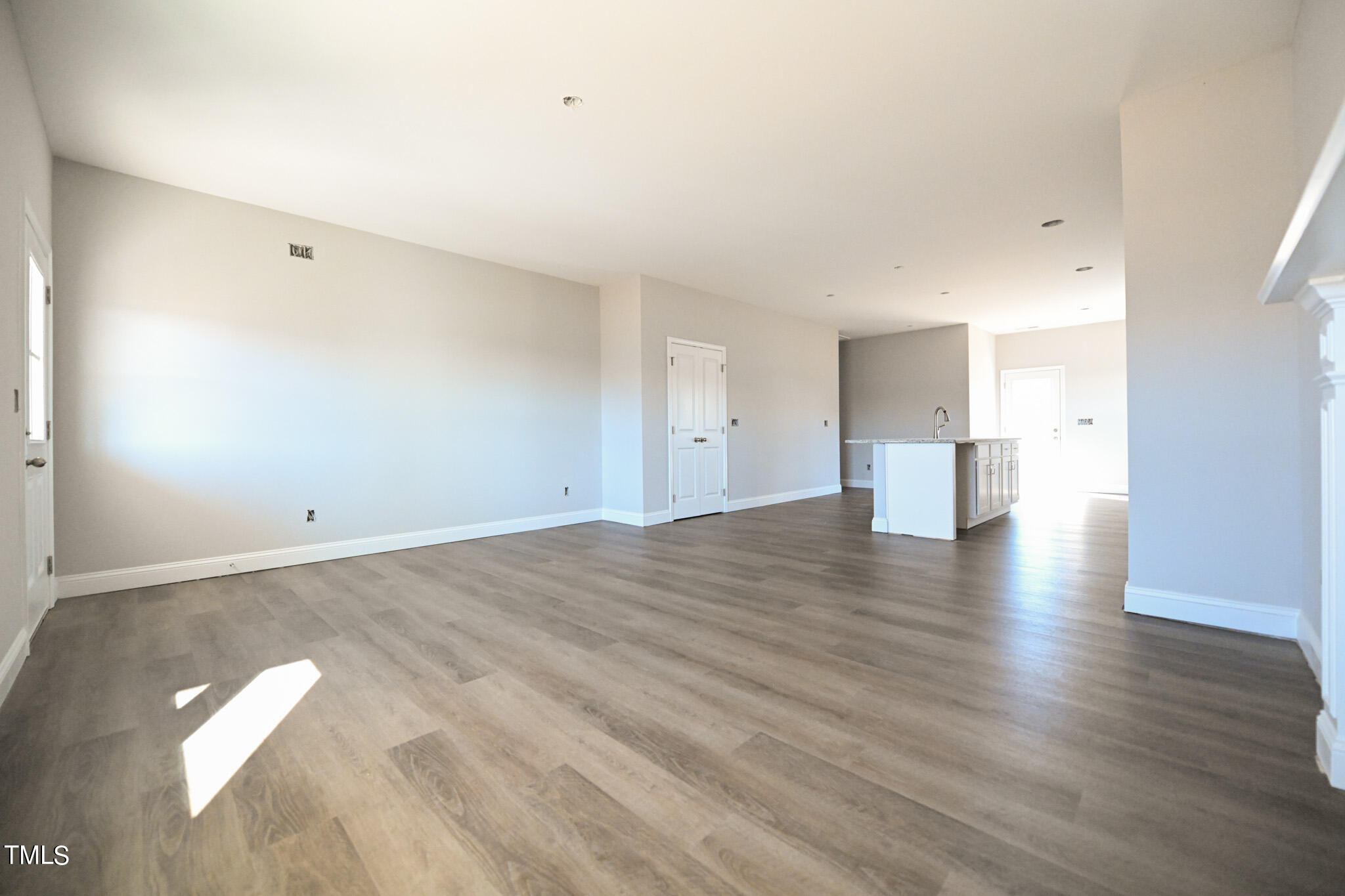 150 Johnson Ridge Way Four Oaks, NC 27524 - Photo 6 of 24 a view of a room with wooden floor and windows