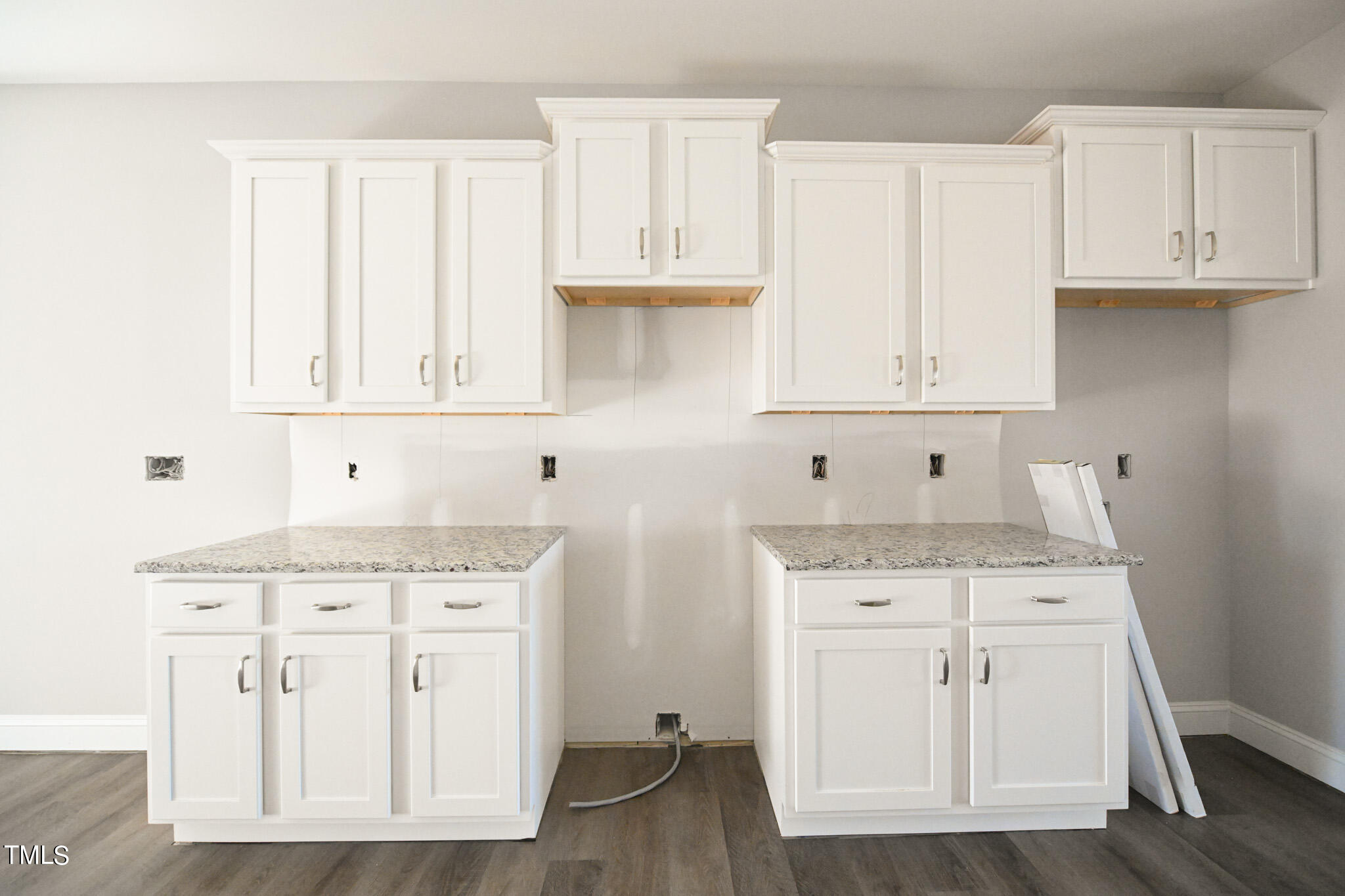 150 Johnson Ridge Way Four Oaks, NC 27524 - Photo 9 of 24 a kitchen with stainless steel appliances granite countertop a sink and cabinets with wooden floor