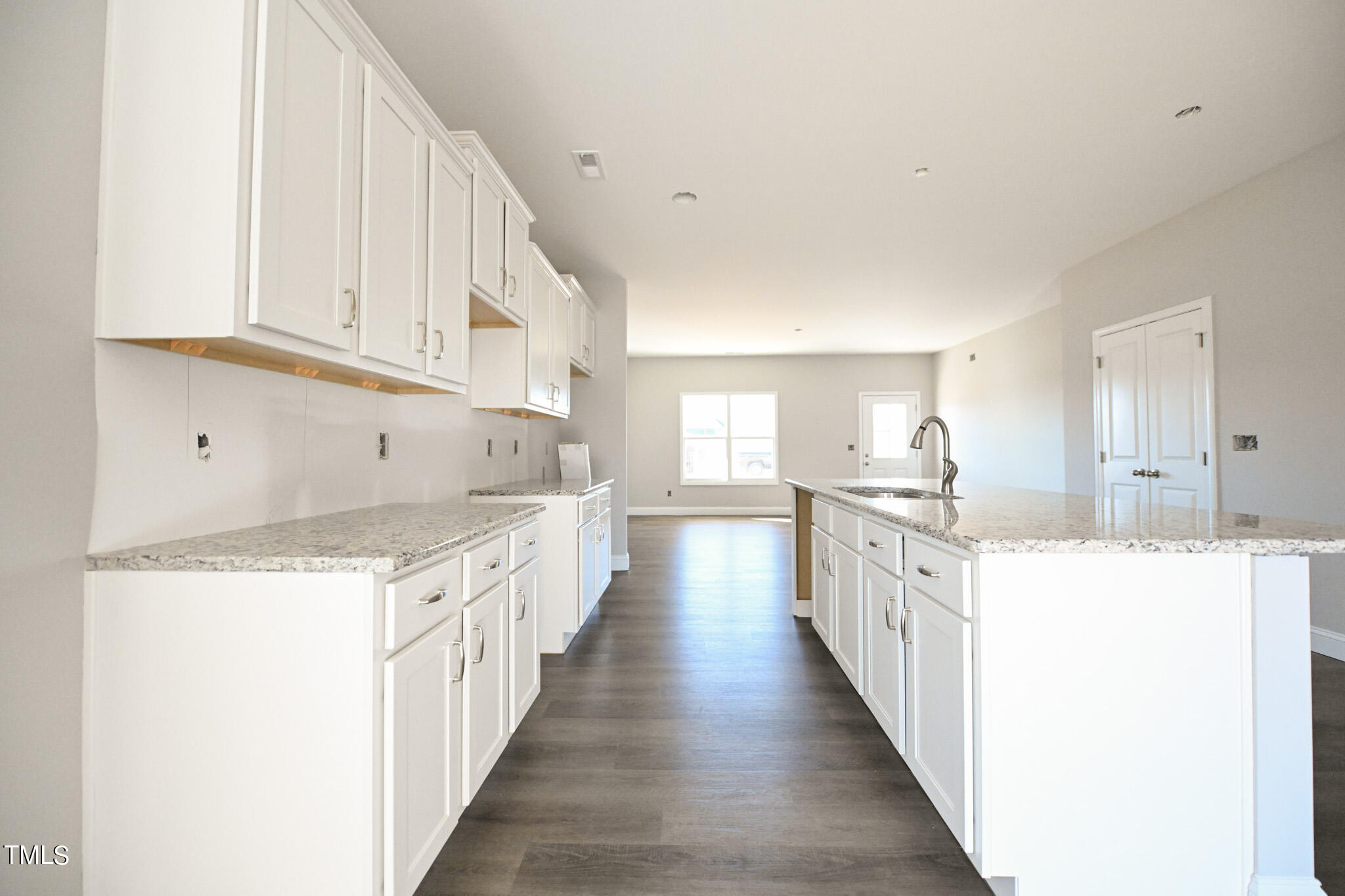 150 Johnson Ridge Way Four Oaks, NC 27524 - Photo 10 of 24 a kitchen with granite countertop lots of counter top space sink and stainless steel appliances