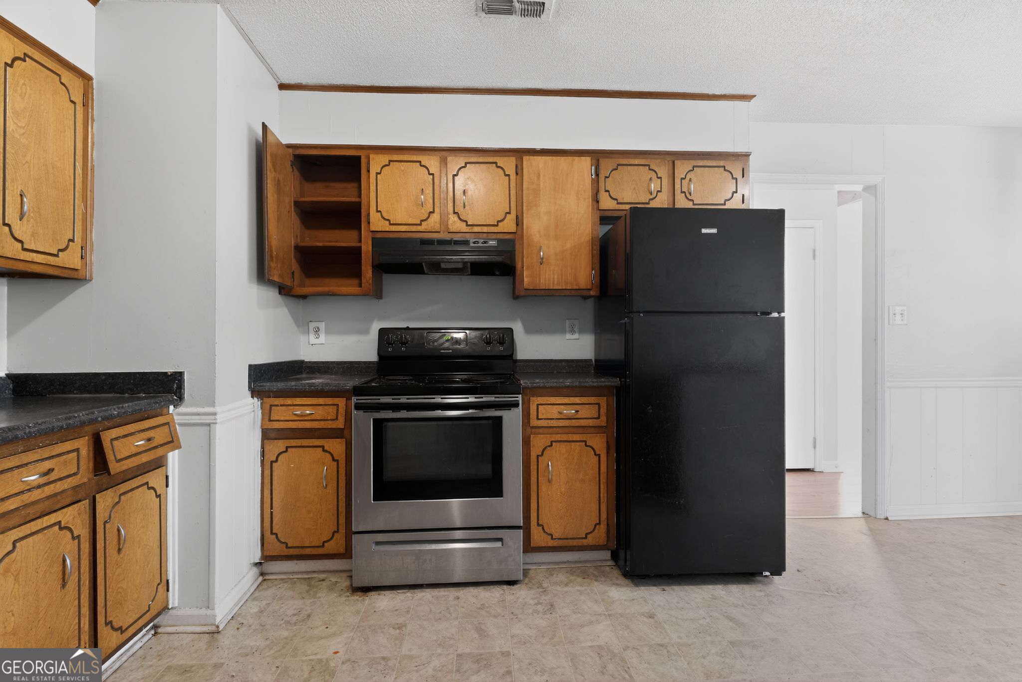 2809 Butler Manor Drive Hephzibah, GA 30815 - Photo 14 of 35 a kitchen with stainless steel appliances granite countertop a refrigerator and a stove