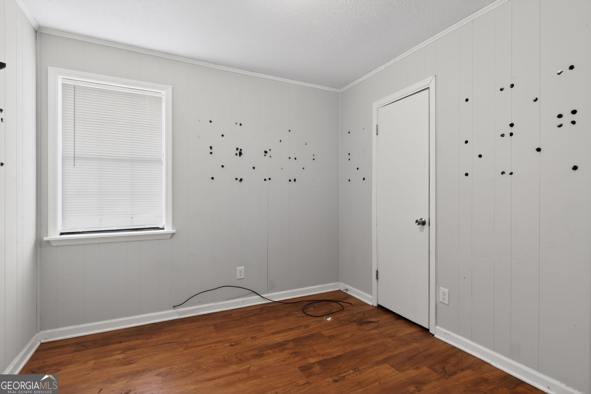 2809 Butler Manor Drive Hephzibah, GA 30815 - Photo 18 of 35 a view of an empty room with wooden floor