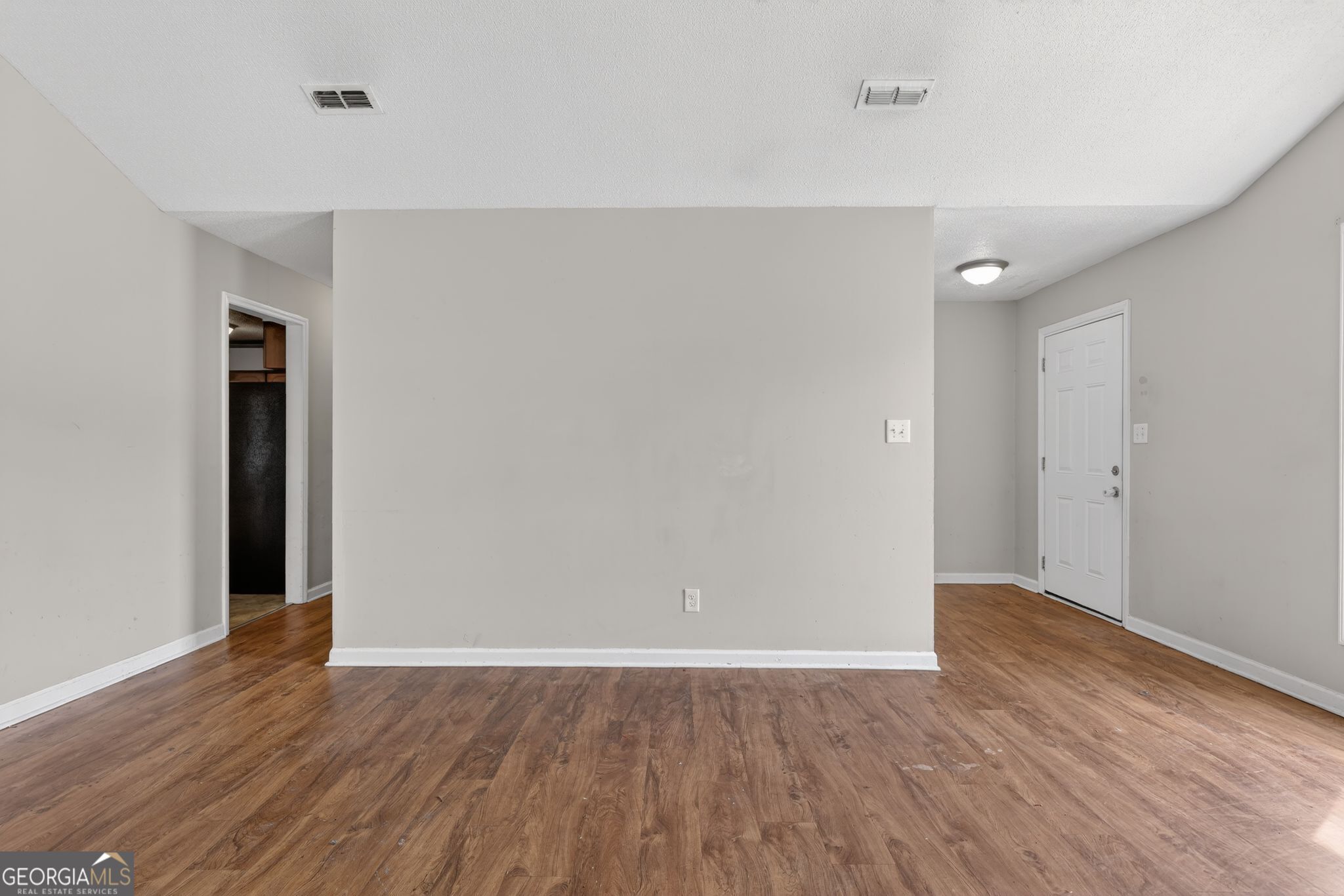 2809 Butler Manor Drive Hephzibah, GA 30815 - Photo 21 of 35 a view of an empty room with wooden floor