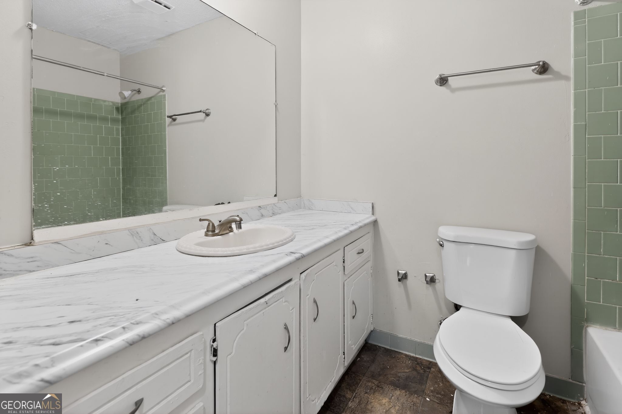 2809 Butler Manor Drive Hephzibah, GA 30815 - Photo 26 of 35 a bathroom with a granite countertop toilet sink and mirror