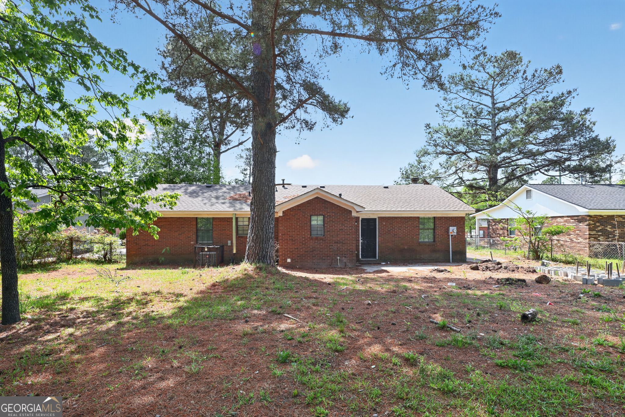 2809 Butler Manor Drive Hephzibah, GA 30815 - Photo 33 of 35 a front view of a house with a yard and large trees