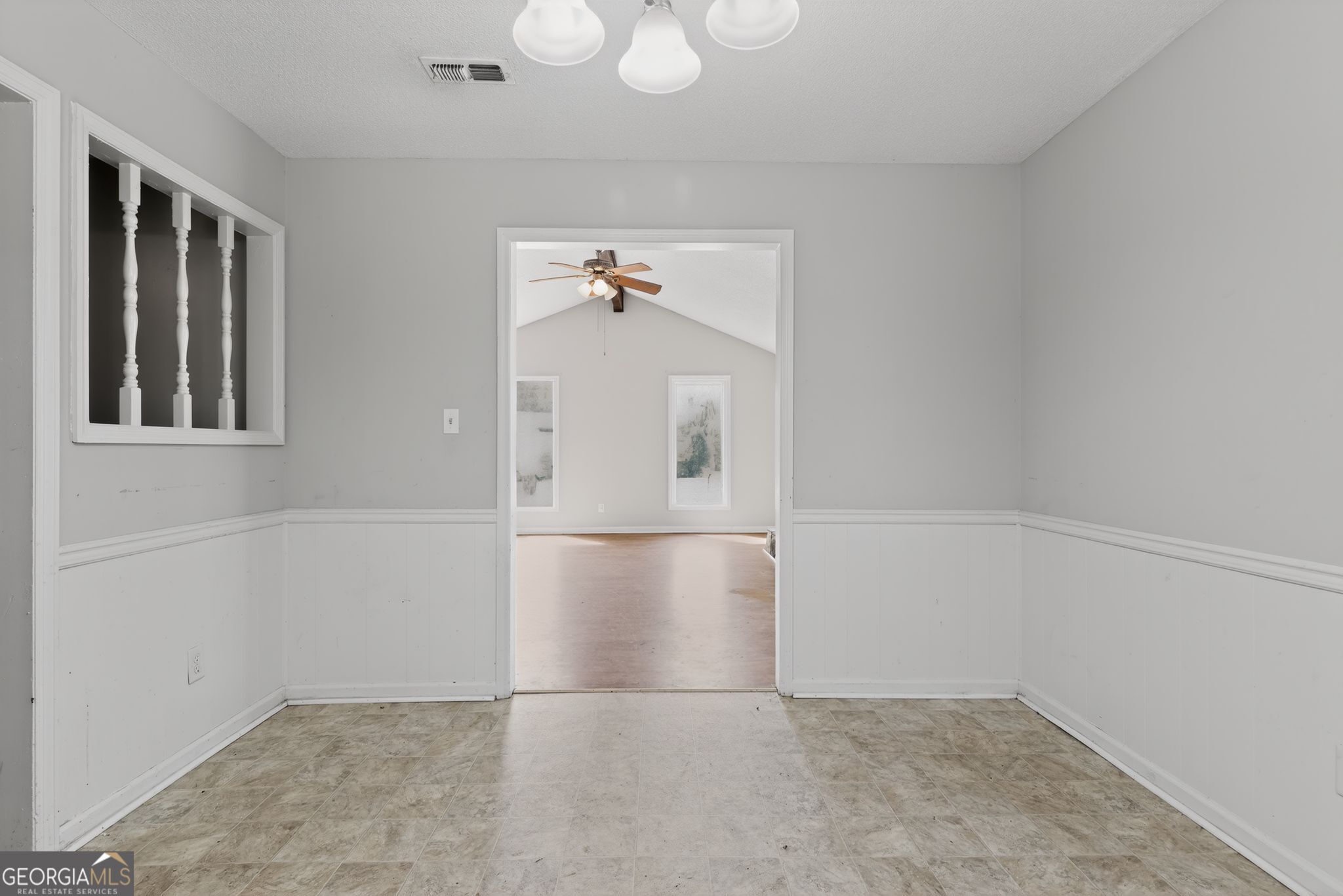 2809 Butler Manor Drive Hephzibah, GA 30815 - Photo 6 of 35 an empty room with windows and cabinet