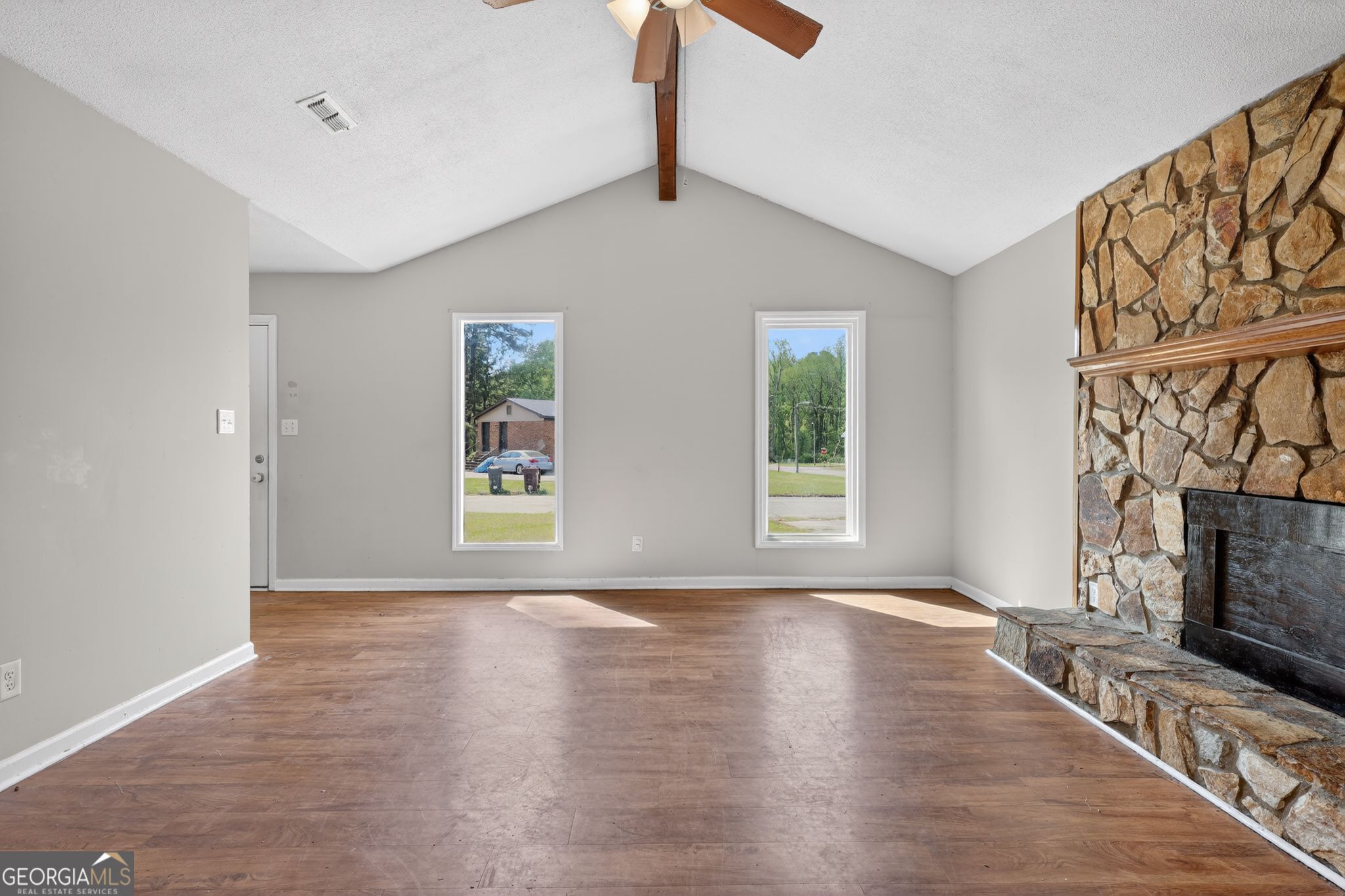 2809 Butler Manor Drive Hephzibah, GA 30815 - Photo 7 of 35 a view of an empty room with window and wooden floor
