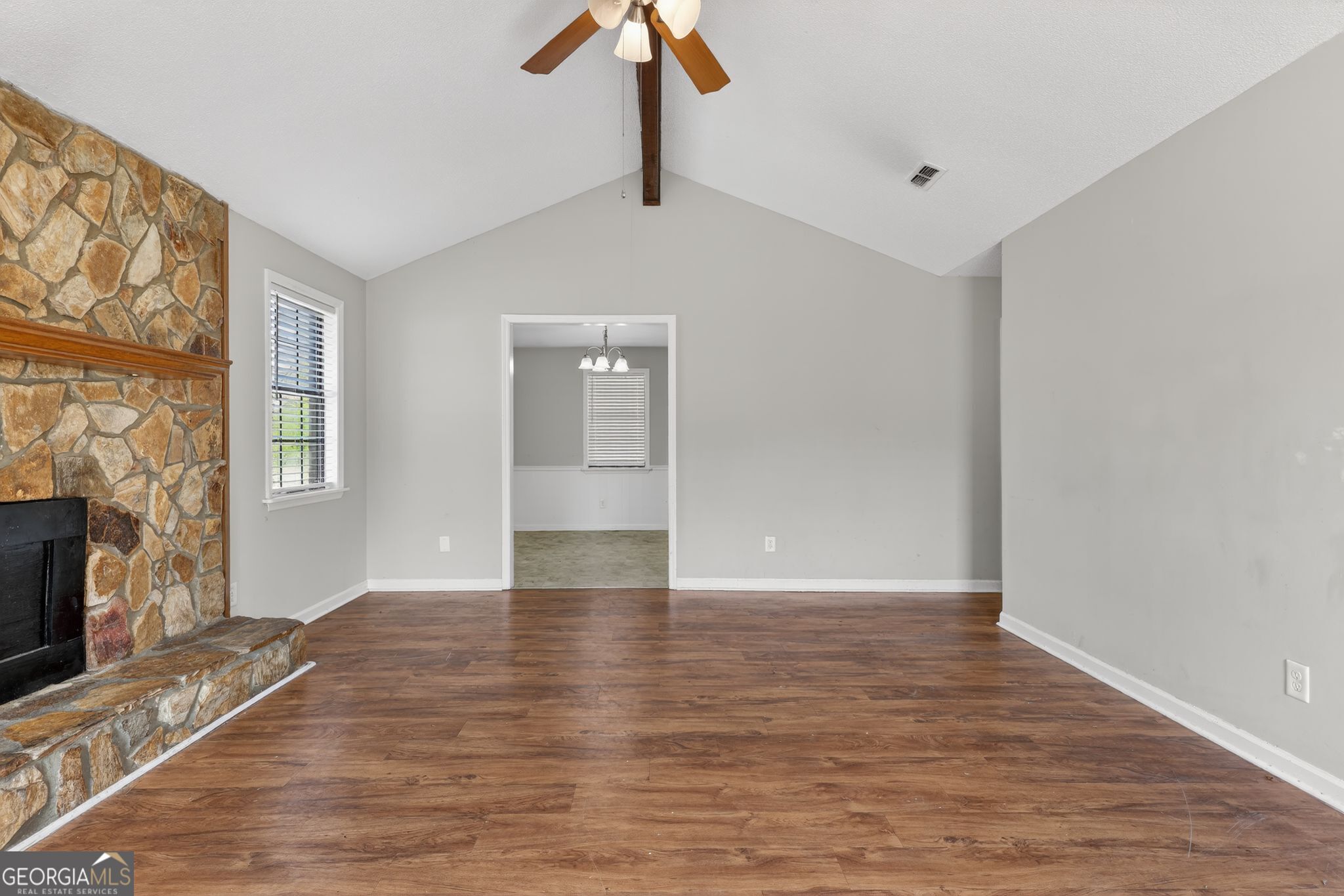 2809 Butler Manor Drive Hephzibah, GA 30815 - Photo 8 of 35 a view of an empty room with window and wooden floor