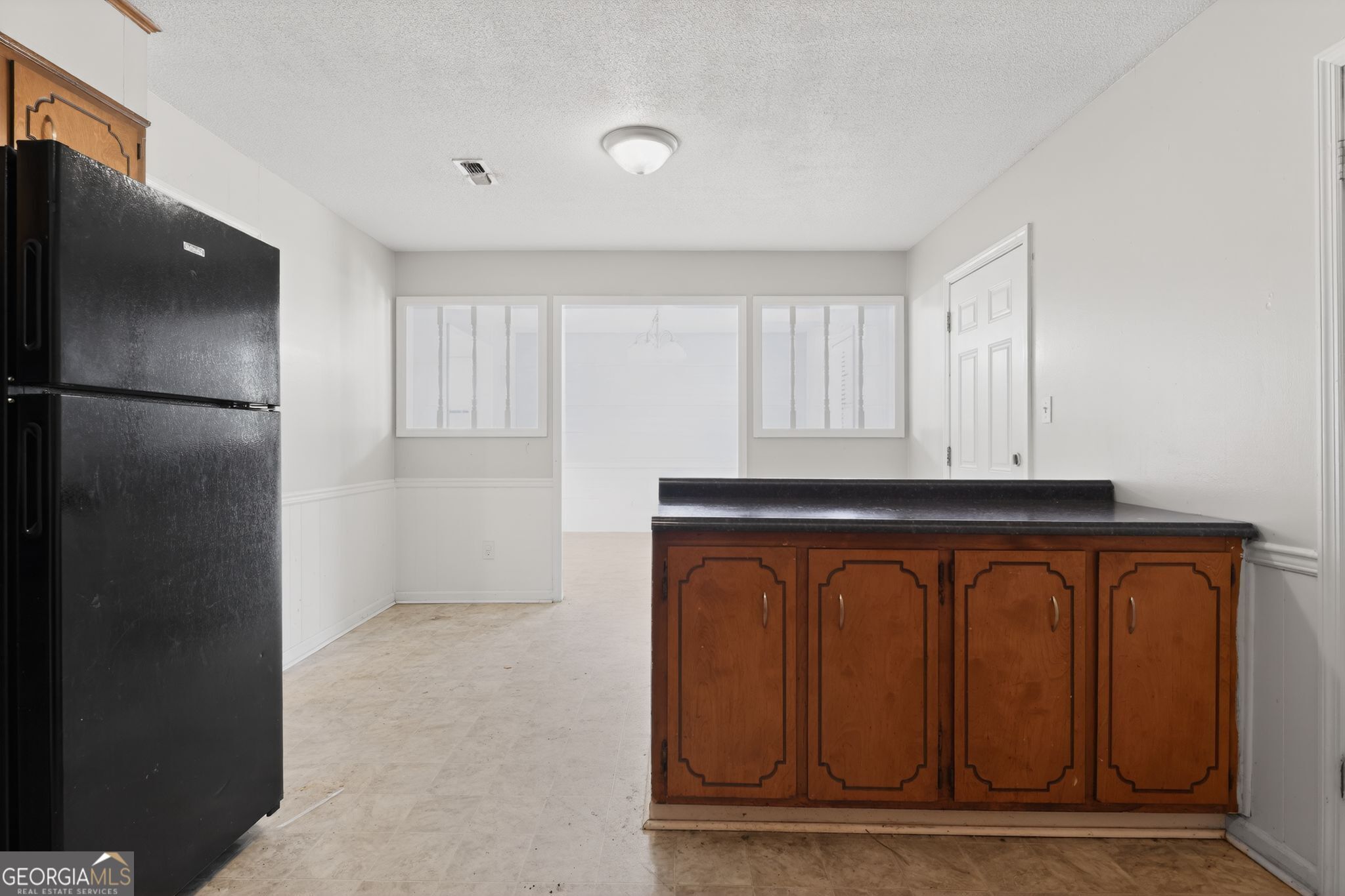 2809 Butler Manor Drive Hephzibah, GA 30815 - Photo 10 of 35 a view of entryway with kitchen and wooden floor