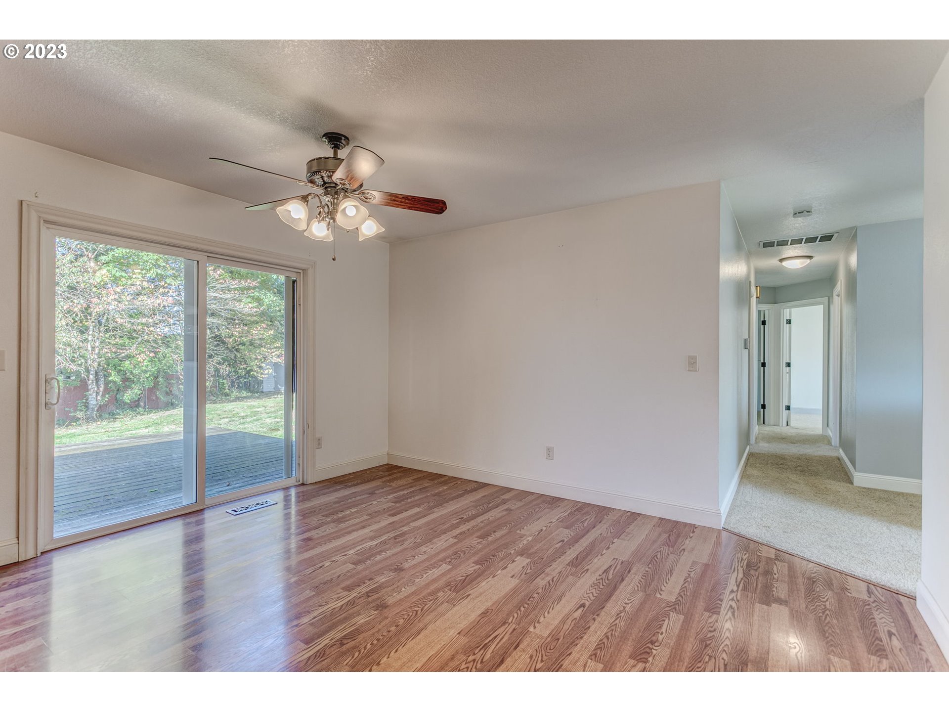 21321 Southeast Alder Street Gresham, OR 97030 - Photo 12 of 39 a view of an empty room with wooden floor and a window