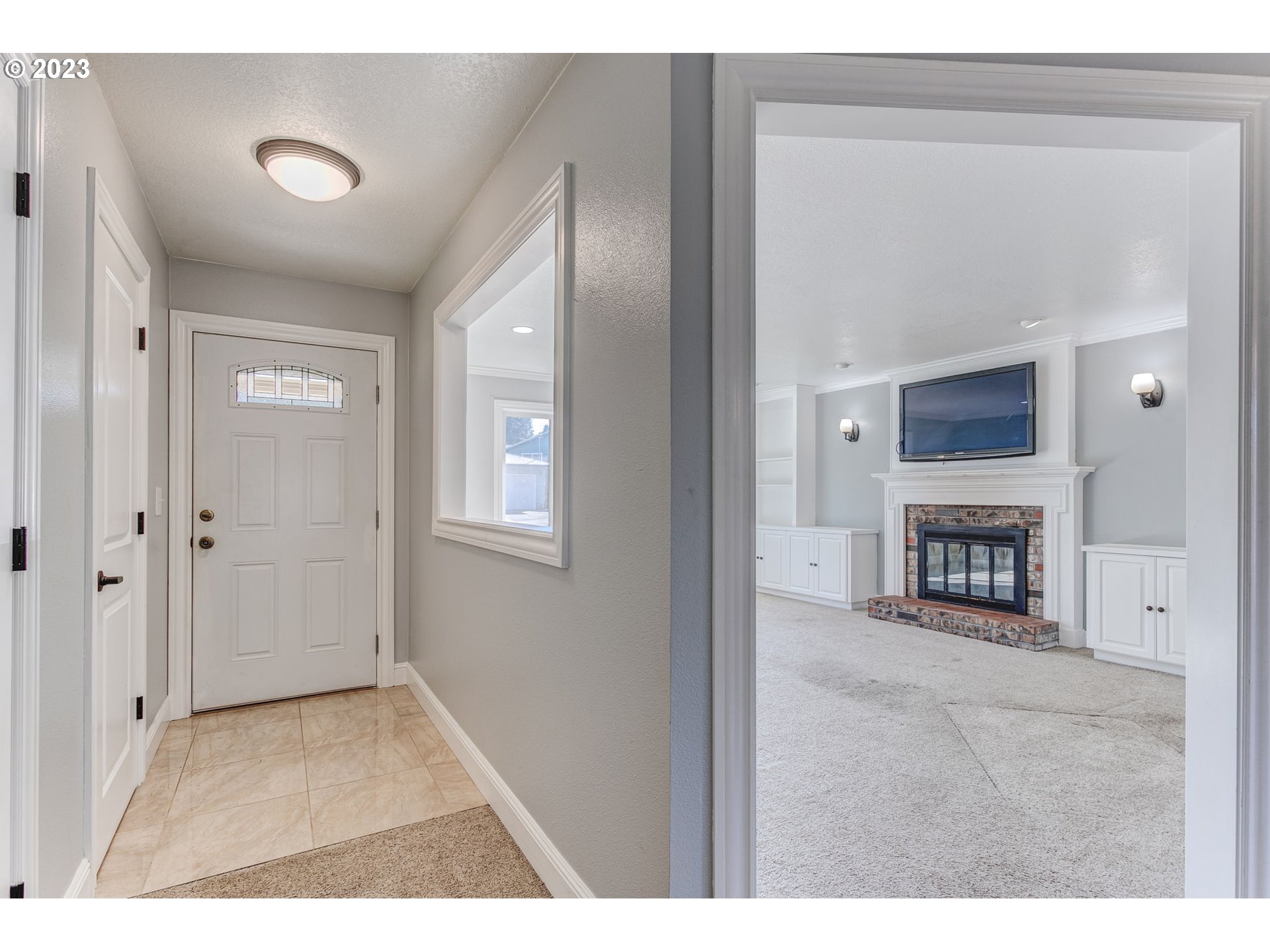 21321 Southeast Alder Street Gresham, OR 97030 - Photo 14 of 39 a view of a livingroom with an empty space and a fireplace