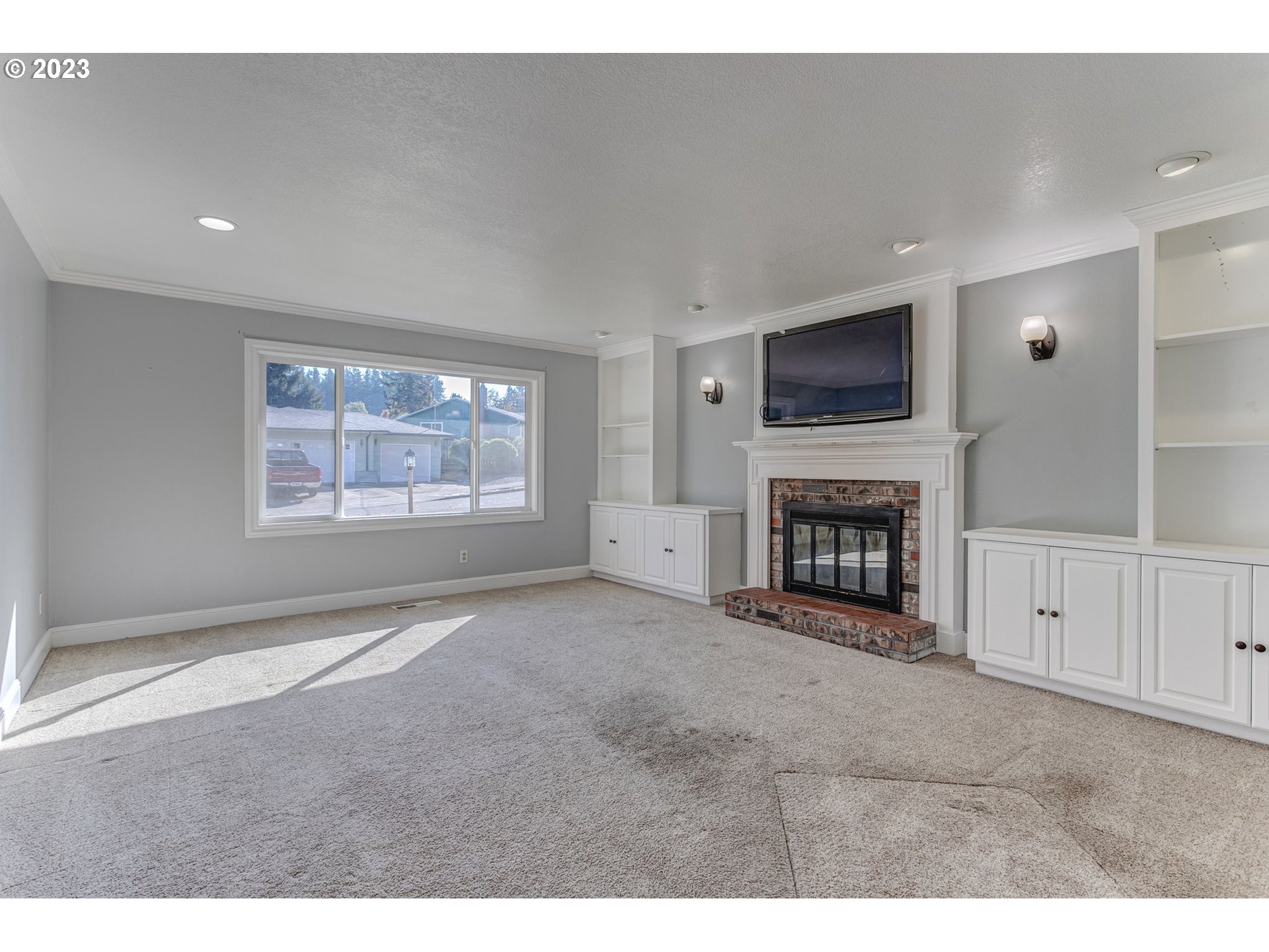 21321 Southeast Alder Street Gresham, OR 97030 - Photo 18 of 39 a view of an empty room with a fireplace and a window
