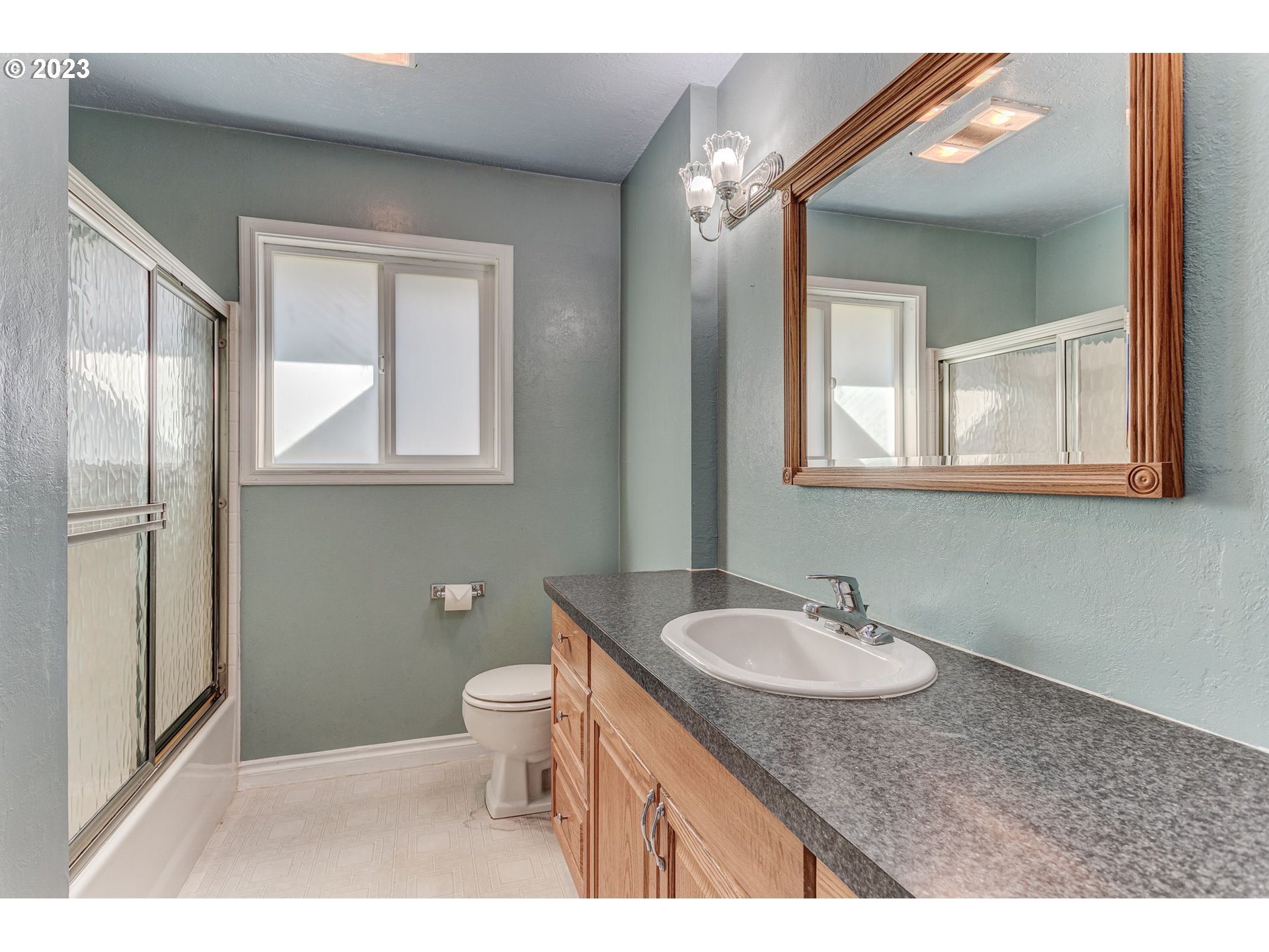 21321 Southeast Alder Street Gresham, OR 97030 - Photo 24 of 39 a bathroom with a granite countertop sink toilet and shower