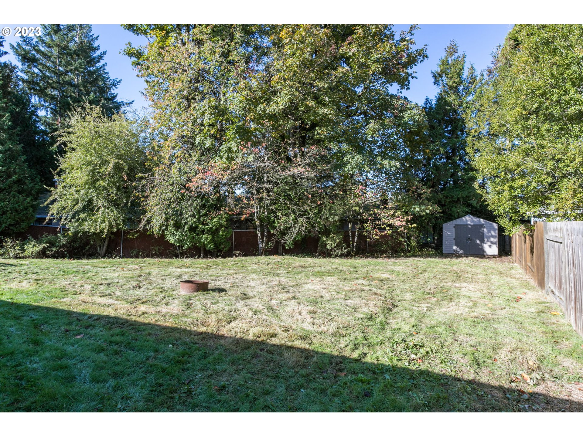 21321 Southeast Alder Street Gresham, OR 97030 - Photo 30 of 39 a view of a yard with a tree