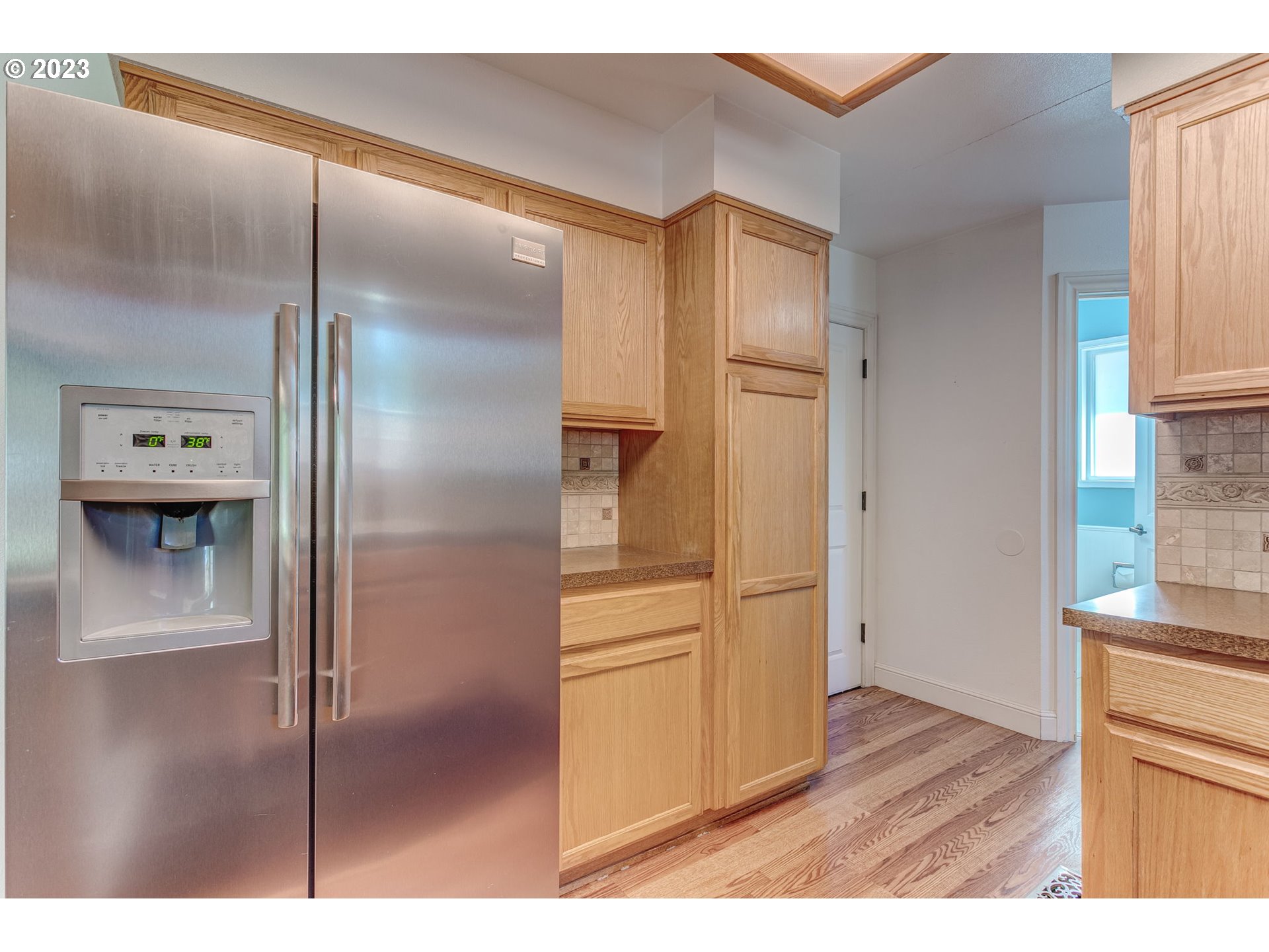 21321 Southeast Alder Street Gresham, OR 97030 - Photo 9 of 39 a kitchen with stainless steel appliances granite countertop a refrigerator and a sink
