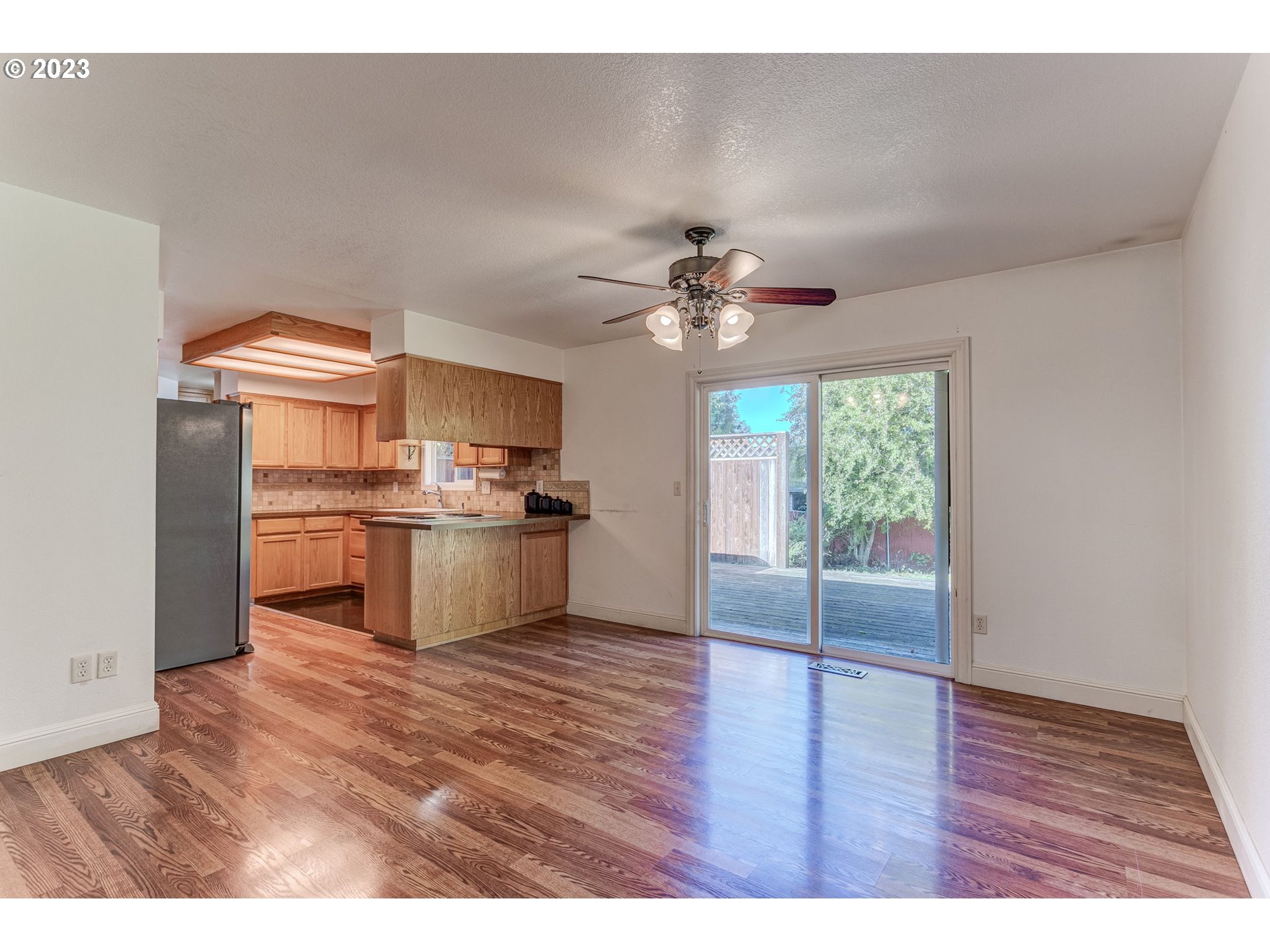 21321 Southeast Alder Street Gresham, OR 97030 - Photo 10 of 39 a open kitchen with granite countertop a sink cabinets and stainless steel appliances