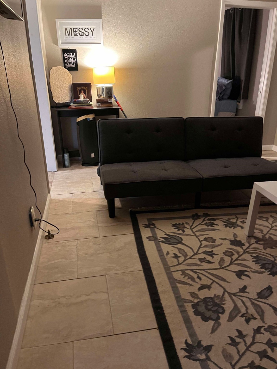 695 Grimes Avenue Silsbee, TX 77656 - Photo 20 of 29 a living room with a couch and a stove next to a window