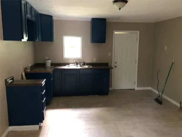 a view of an empty room and a window