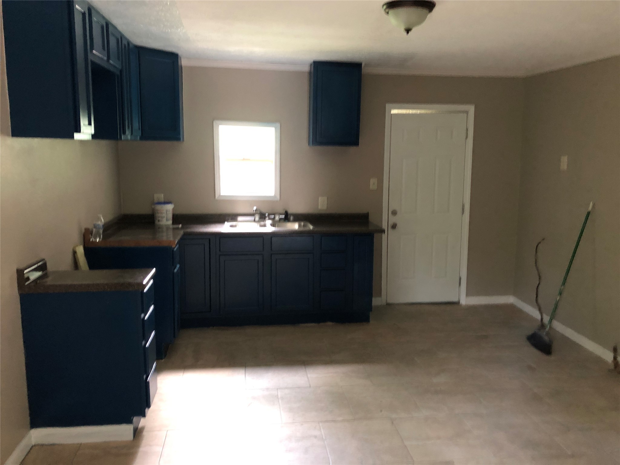 695 Grimes Avenue Silsbee, TX 77656 - Photo 25 of 29 a kitchen with a sink and cabinets
