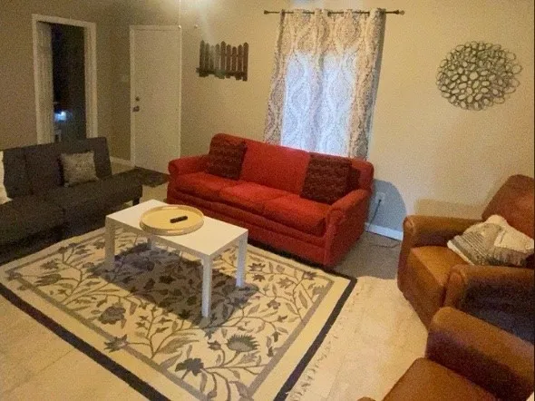 a living room with furniture and a couch
