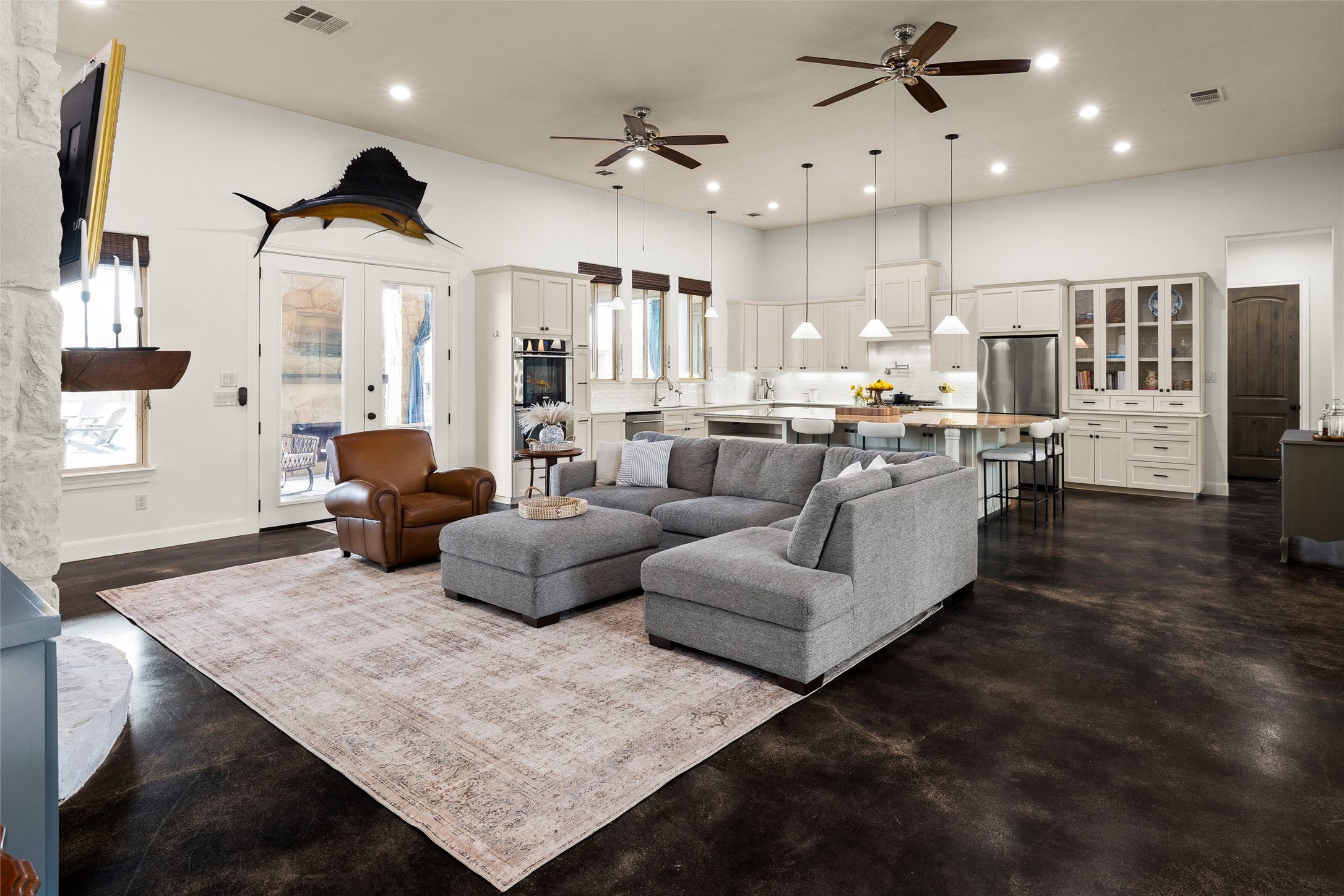 106 Fallow Way Bastrop, TX 78602 - Photo 13 of 40 view of living room and kitchen from the hallway to the secondary bedrooms