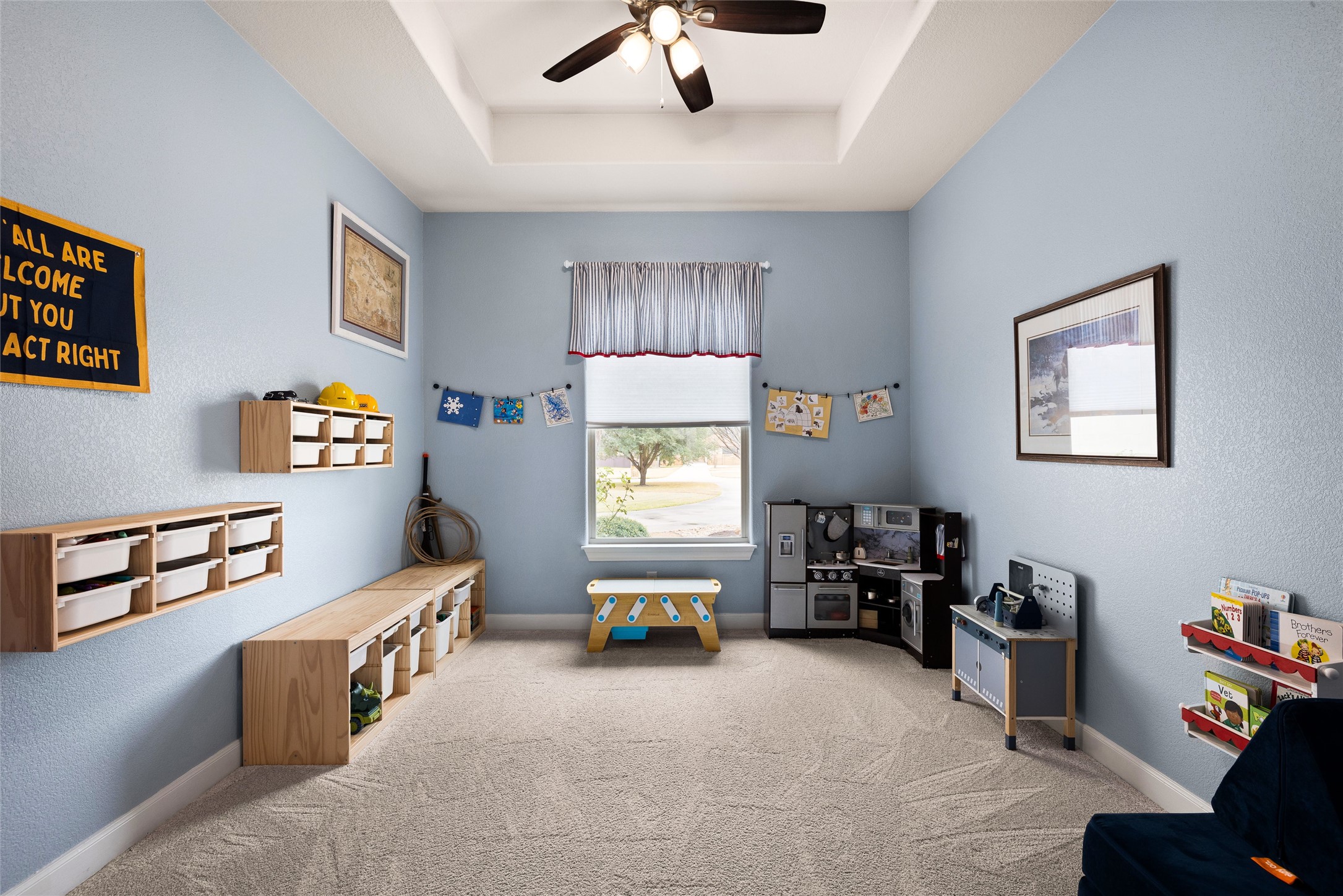 106 Fallow Way Bastrop, TX 78602 - Photo 18 of 40 Additional living area located off of kitchen with large window overlooking the front yard. Perfect for a playroom, office, den, or whatever you want it to be!