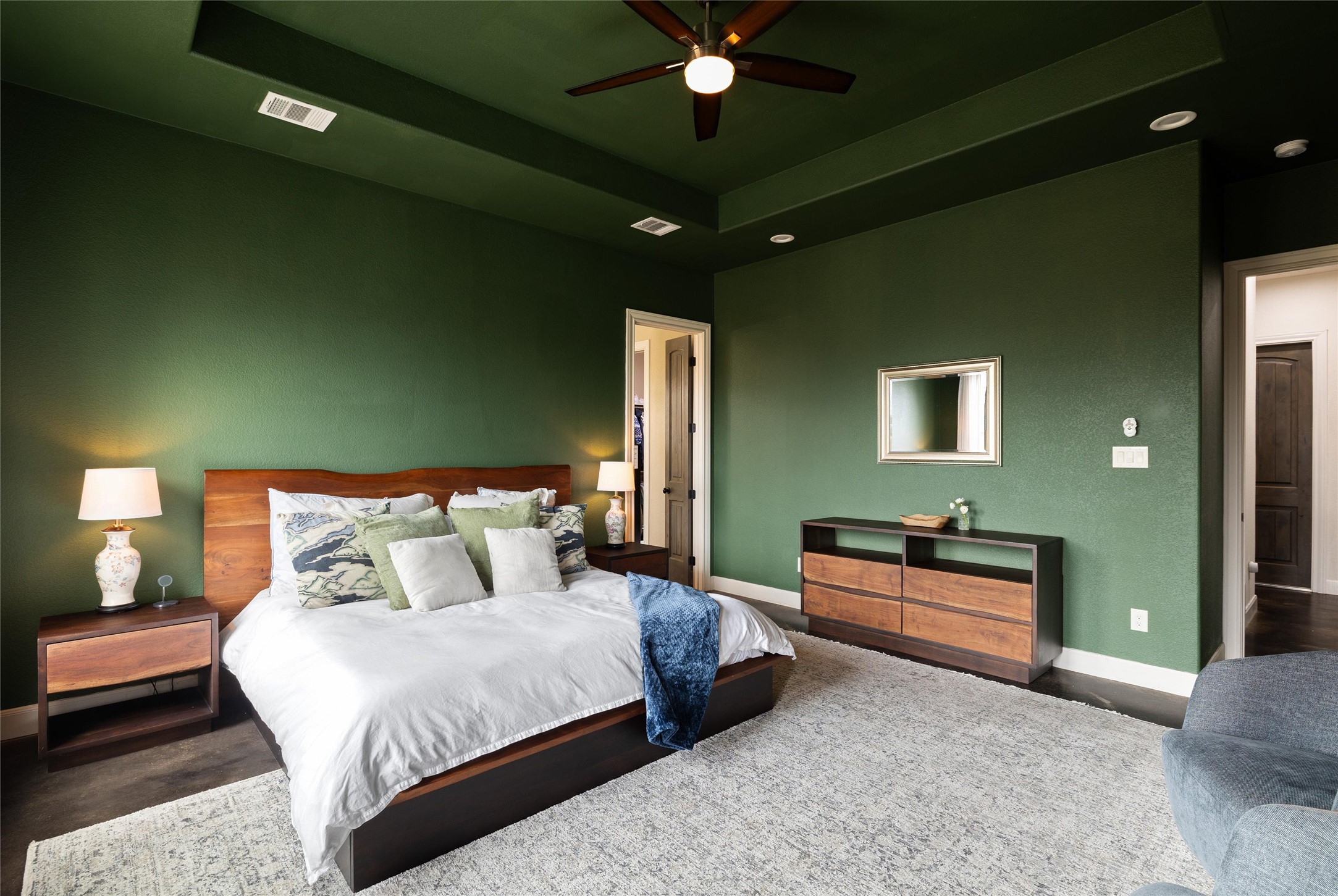 106 Fallow Way Bastrop, TX 78602 - Photo 20 of 40 Bedroom with a tray ceiling en-suite bathroom