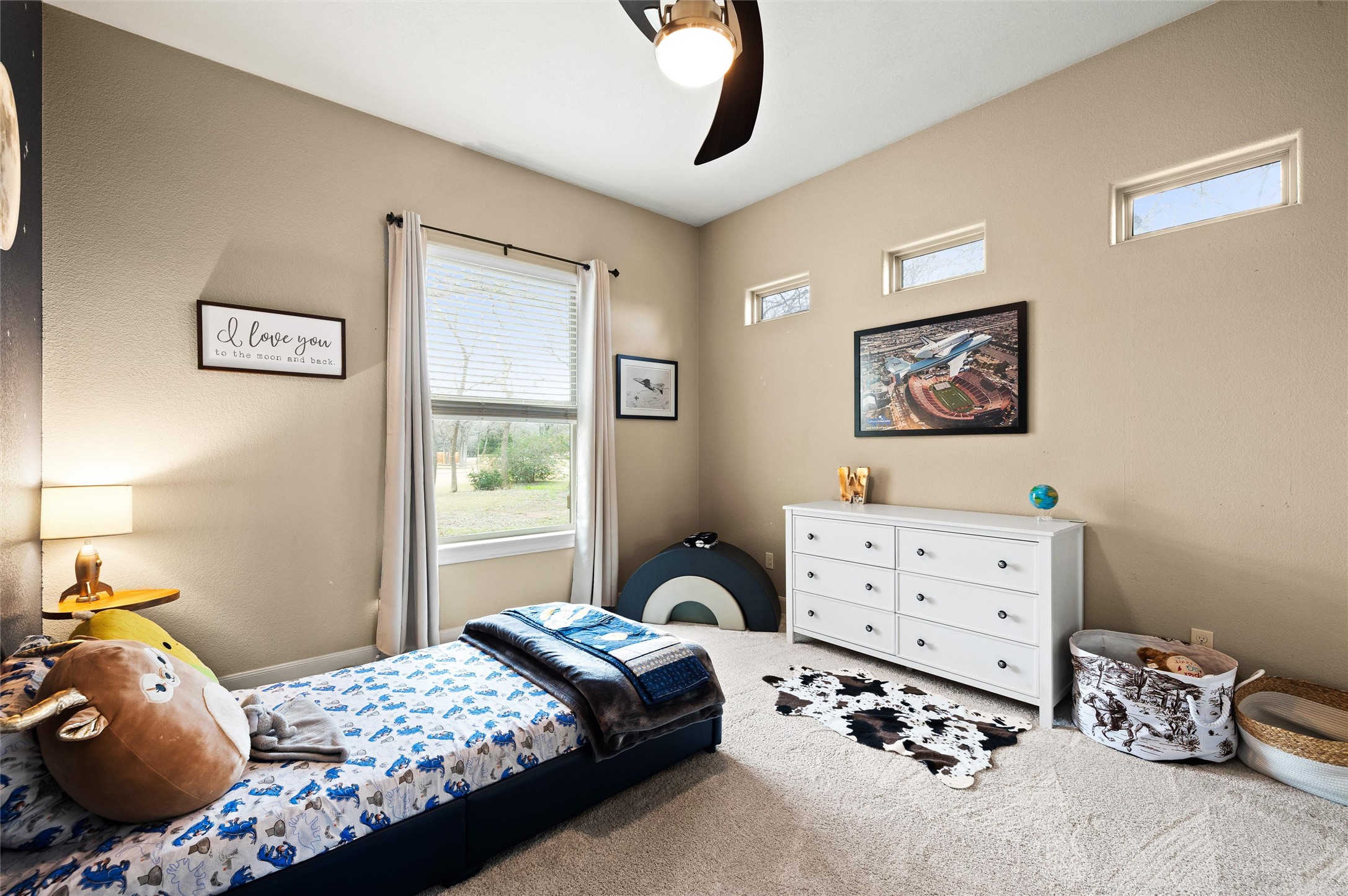 106 Fallow Way Bastrop, TX 78602 - Photo 25 of 40 Secondary bedroom #2 with walk-in closet, large window overlooking front yard and attached Jack & Jill bathroom shared with bedroom #3