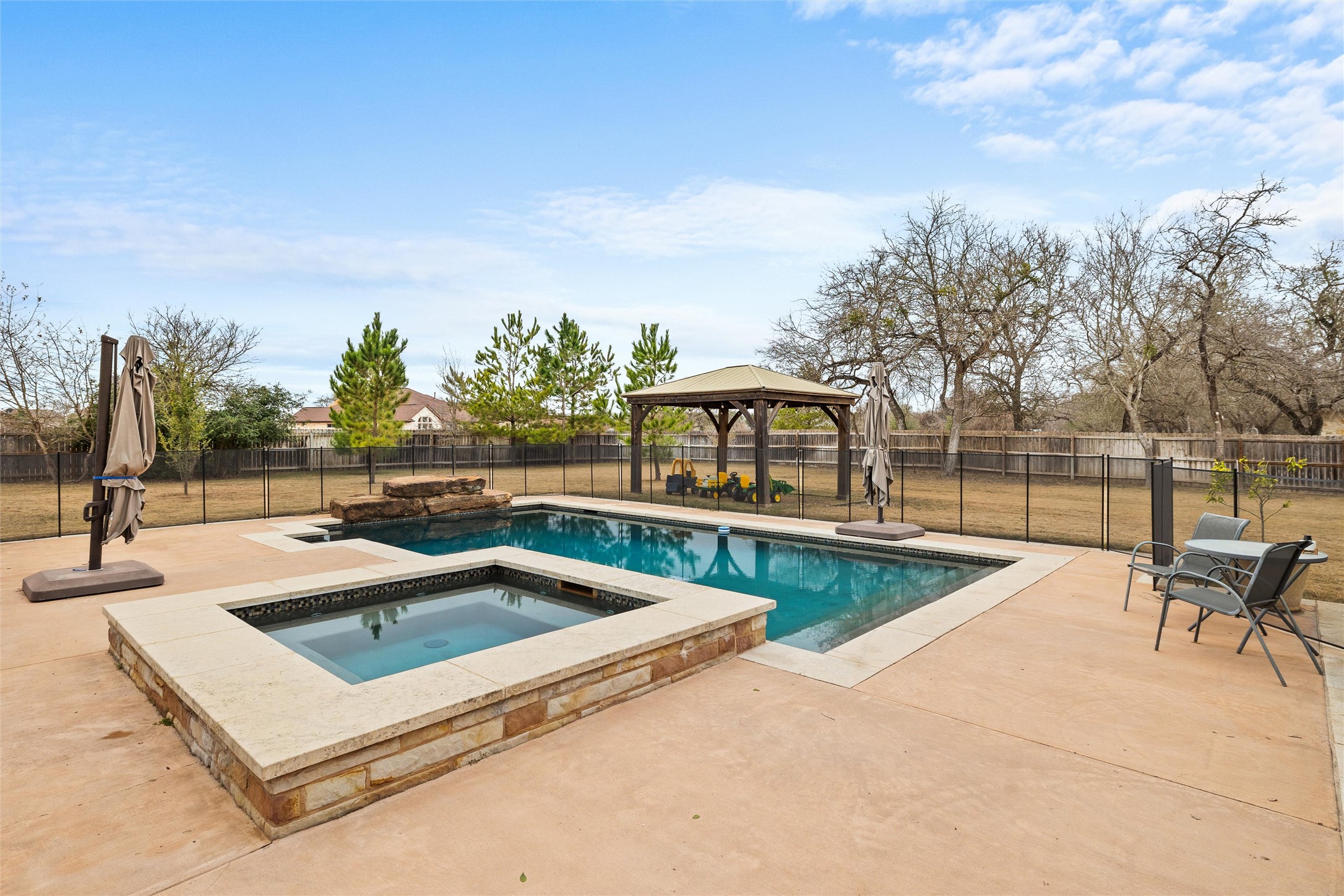 106 Fallow Way Bastrop, TX 78602 - Photo 36 of 40 Pool & spa with a gazebo next to it