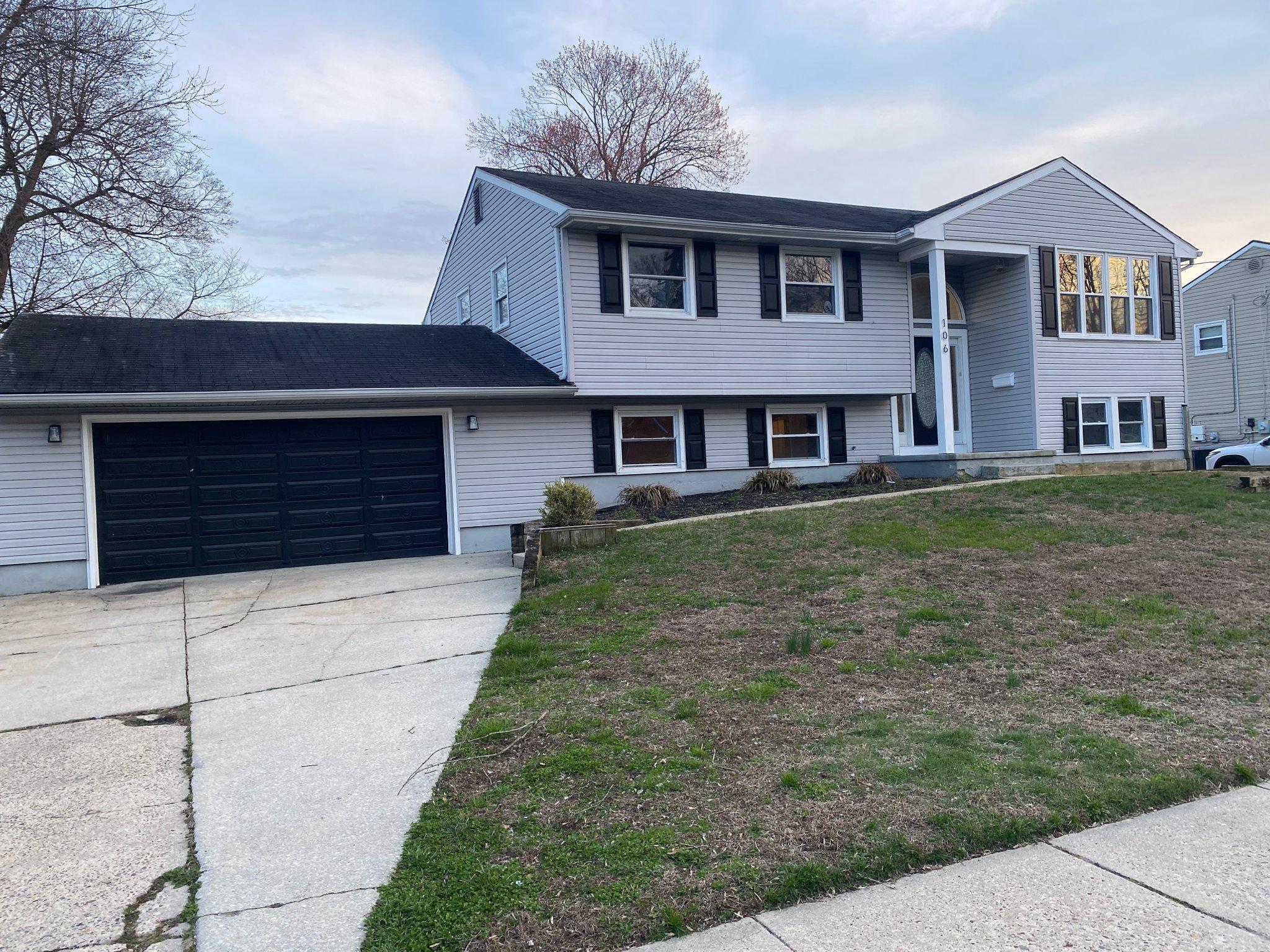 106 Parkview Road Stratford, NJ 08084 - Photo 2 of 27 a front view of a house with a yard