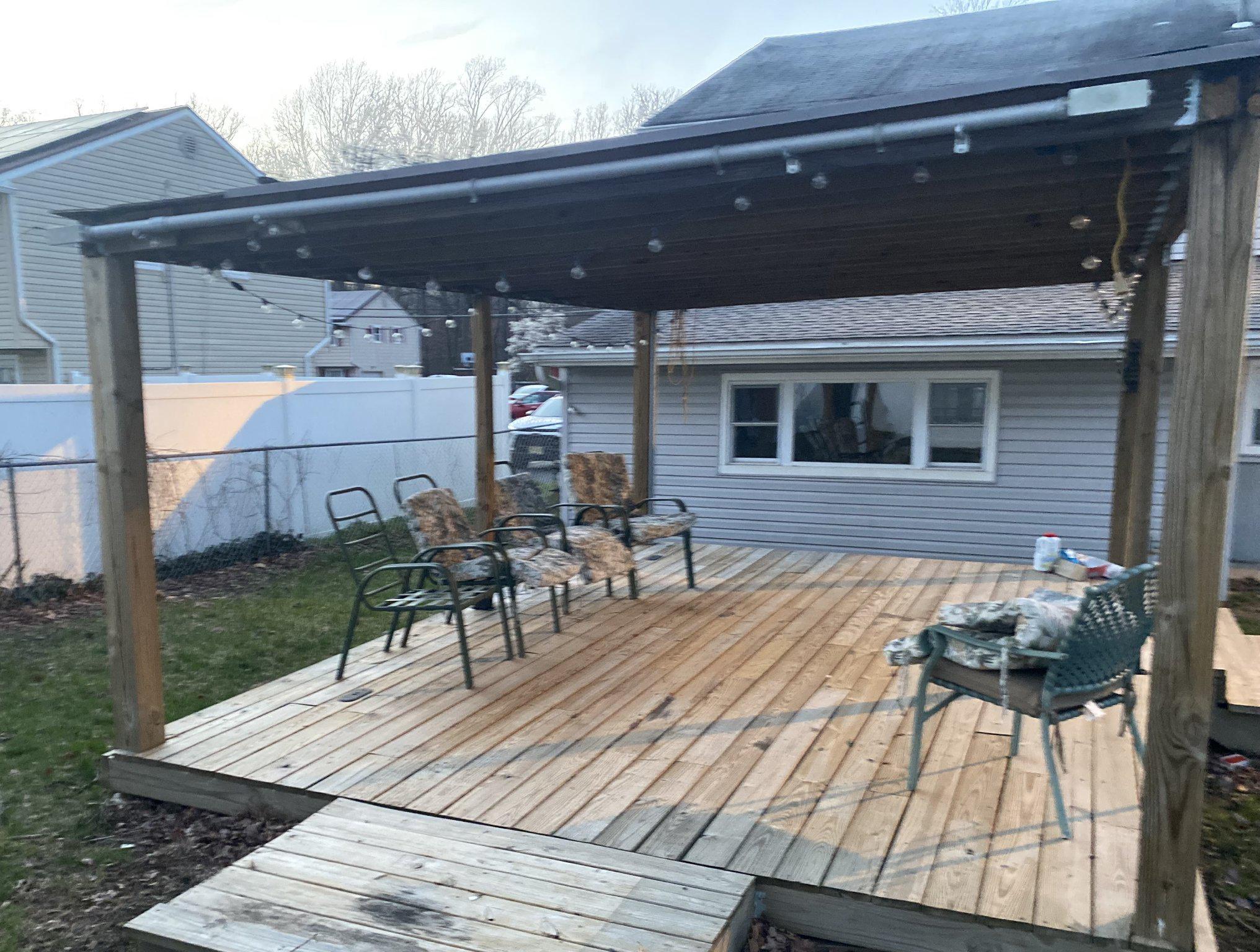 106 Parkview Road Stratford, NJ 08084 - Photo 25 of 27 a view of a patio with table and chairs with wooden floor and fence