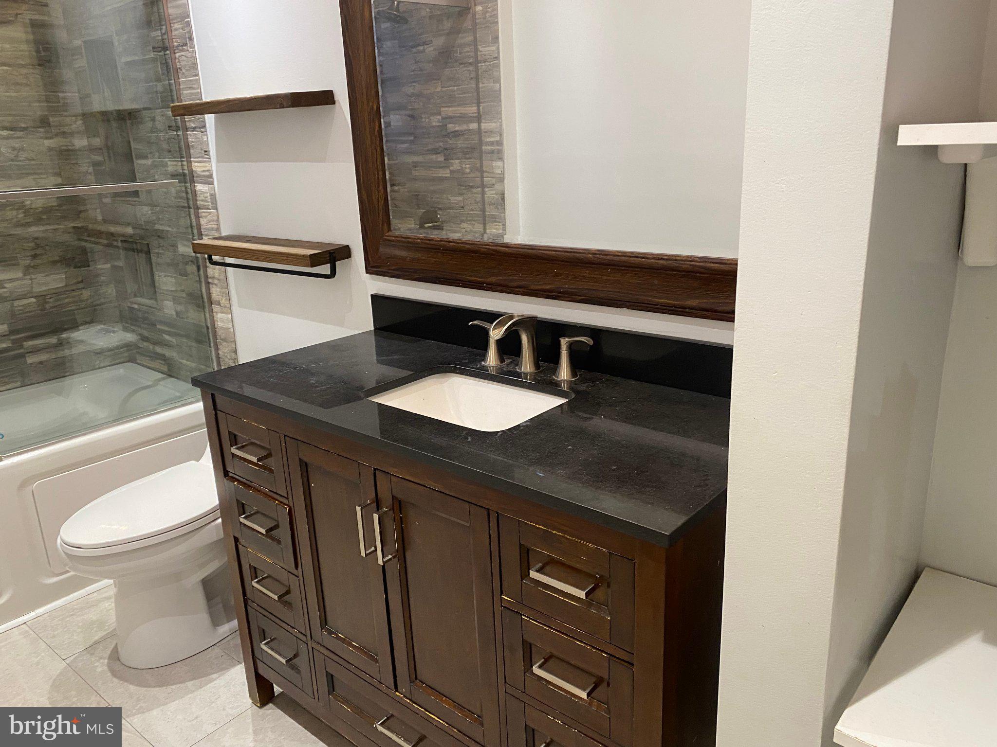 106 Parkview Road Stratford, NJ 08084 - Photo 9 of 27 a bathroom with a sink a toilet and a bathtub